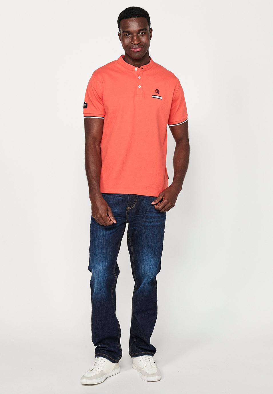 Short-sleeved cotton polo shirt with ribbed finish with round neck with buttoned opening and side slits in coral color for men 6
