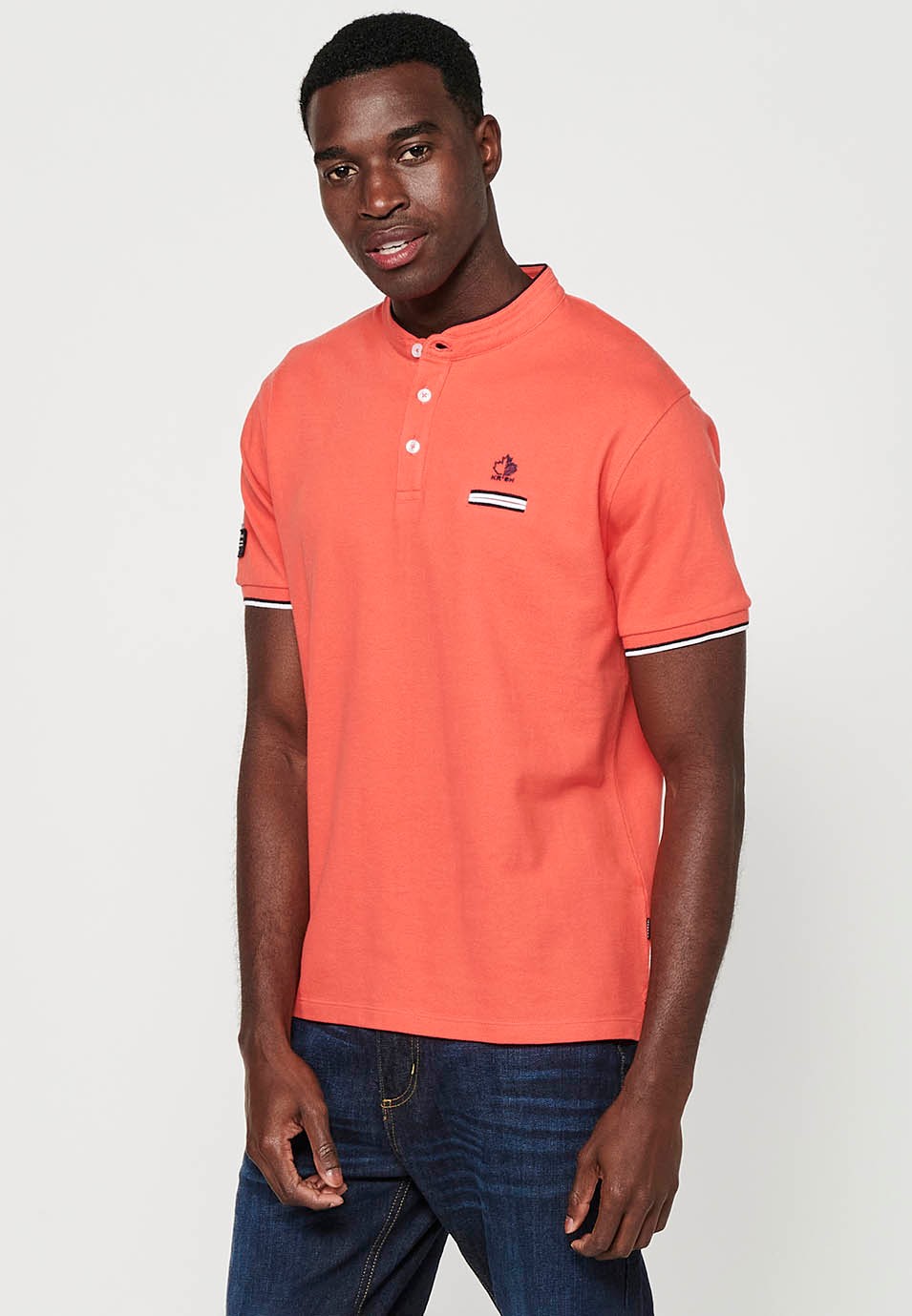 Short-sleeved cotton polo shirt with ribbed finish with round neck with buttoned opening and side slits in coral color for men 4
