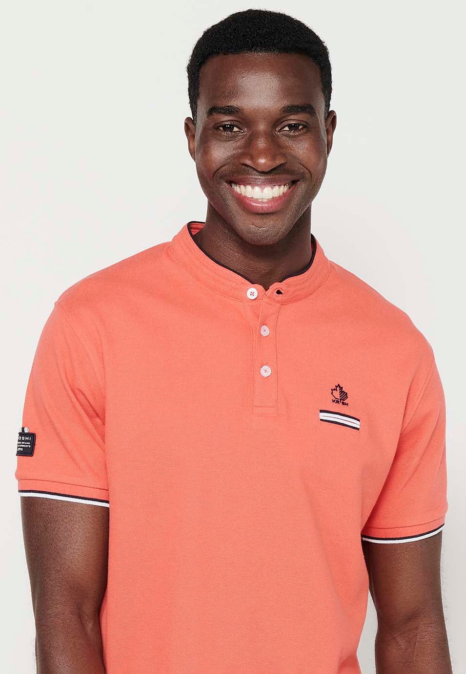 Short-sleeved cotton polo shirt with ribbed finish with round neck with buttoned opening and side slits in coral color for men 7