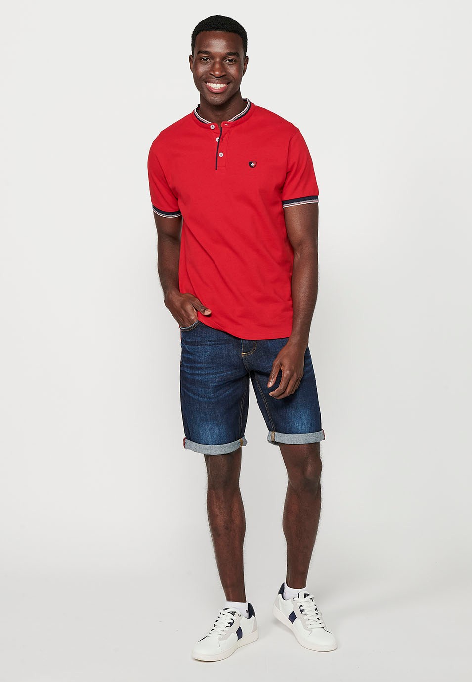 Short-sleeved cotton polo shirt finished in rib with a round neck with buttoned opening and textured with side slits in Red for Men 1