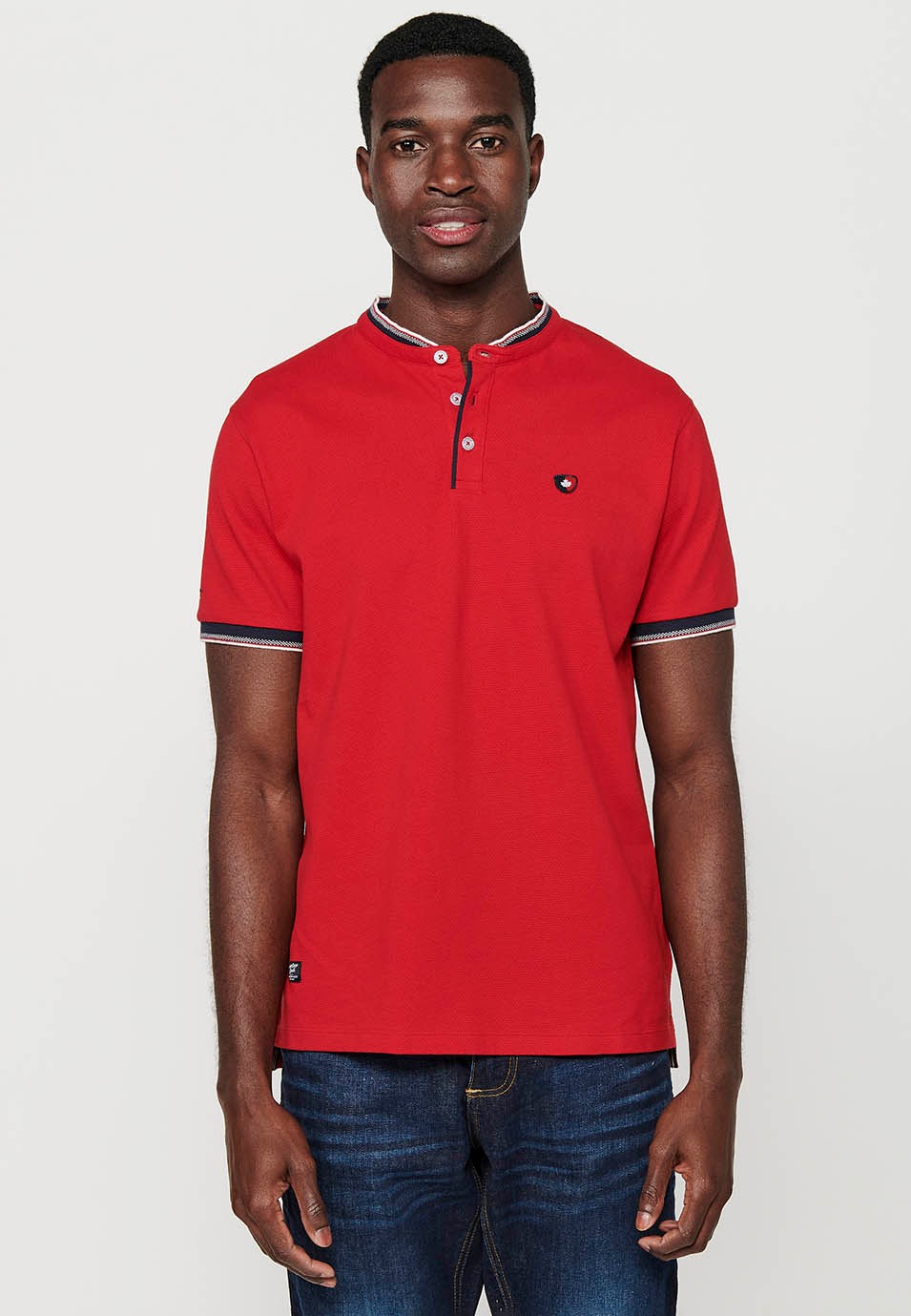 Short-sleeved cotton polo shirt finished in rib with a round neck with buttoned opening and textured with side slits in Red for Men 3