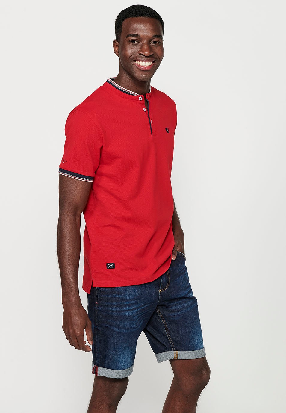 Short-sleeved cotton polo shirt finished in rib with a round neck with buttoned opening and textured with side slits in Red for Men 6