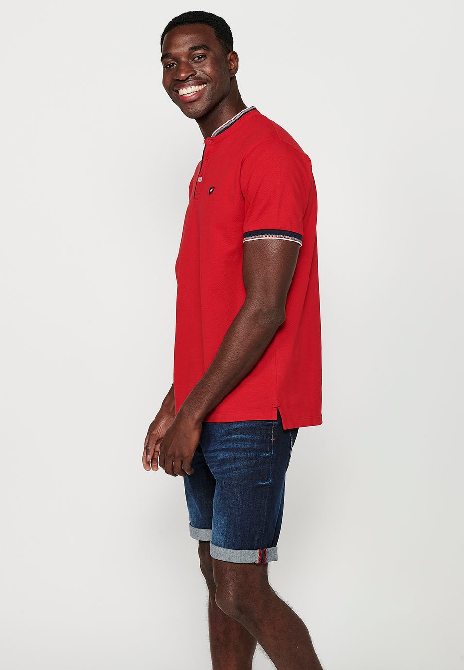 Short-sleeved cotton polo shirt finished in rib with a round neck with buttoned opening and textured with side slits in Red for Men 5