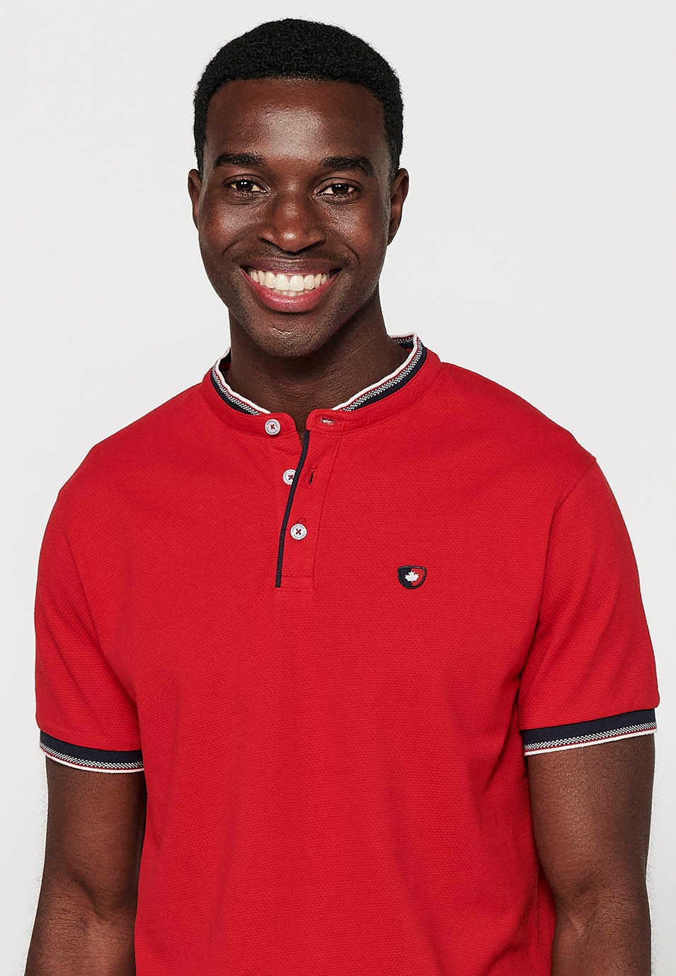 Short-sleeved cotton polo shirt finished in rib with a round neck with buttoned opening and textured with side slits in Red for Men 4
