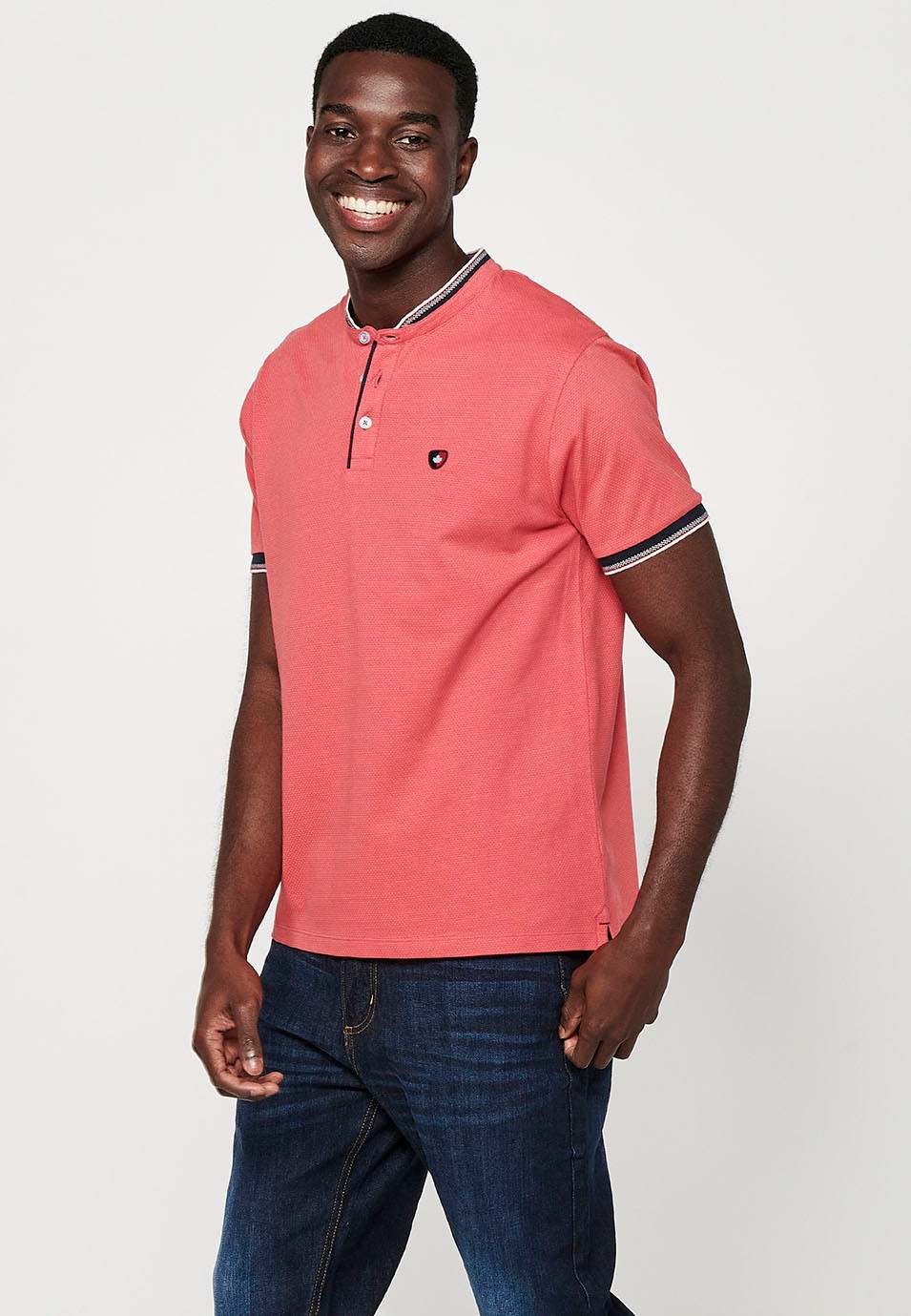 Short-sleeved cotton polo shirt with ribbed finish with round neck with buttoned opening and textured with side slits in Pink for Men 2