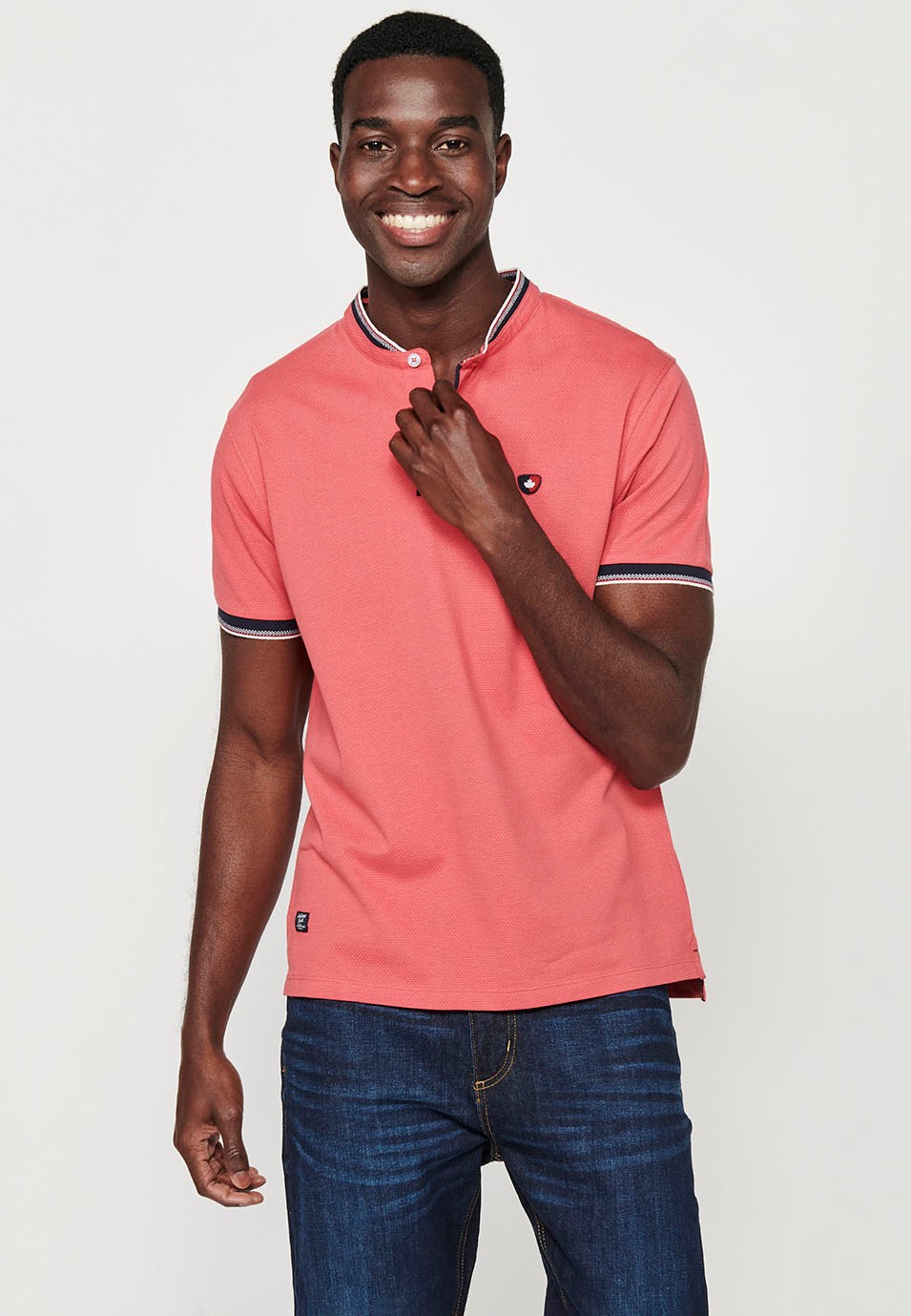 Short-sleeved cotton polo shirt with ribbed finish with round neck with buttoned opening and textured with side slits in Pink for Men 6