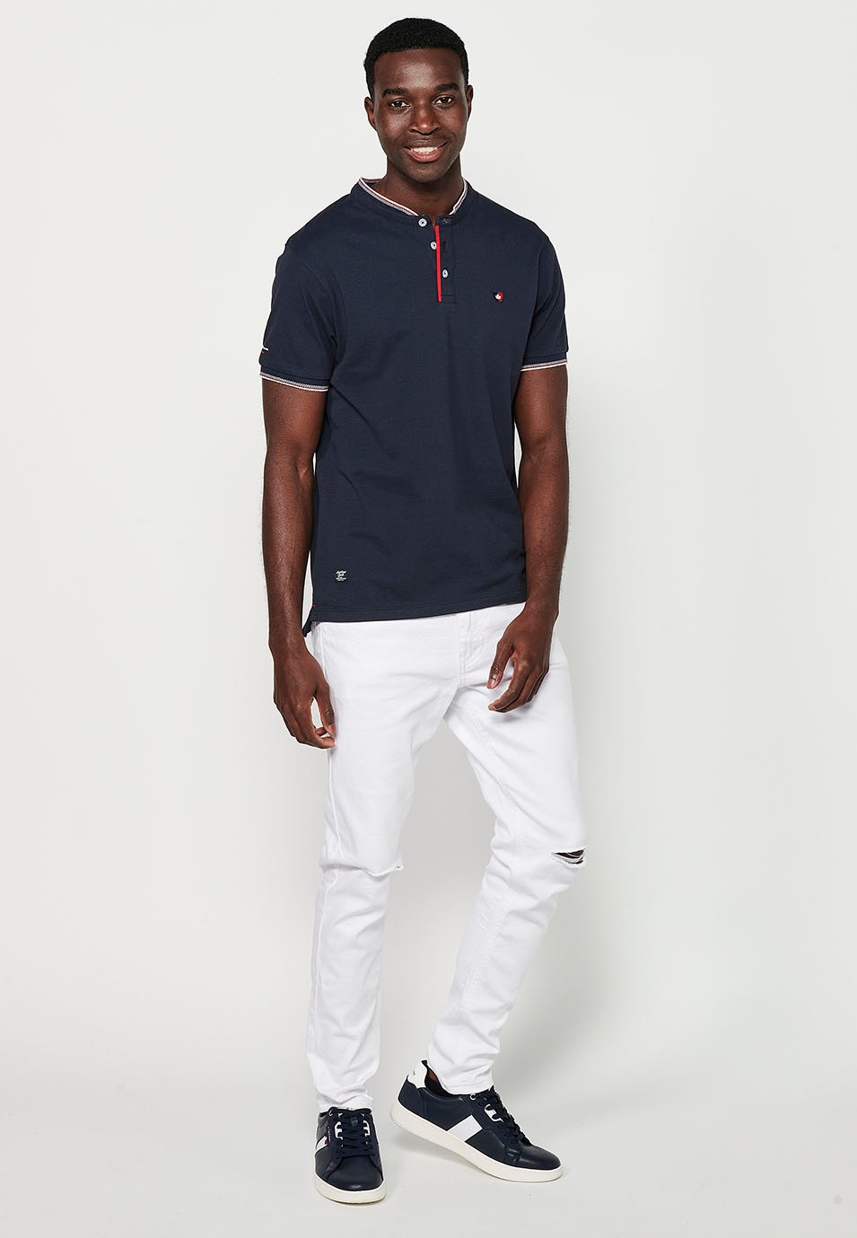 Short-sleeved cotton polo shirt with ribbed finish with round neck, buttoned opening and textured side slits in Navy Color for Men 1