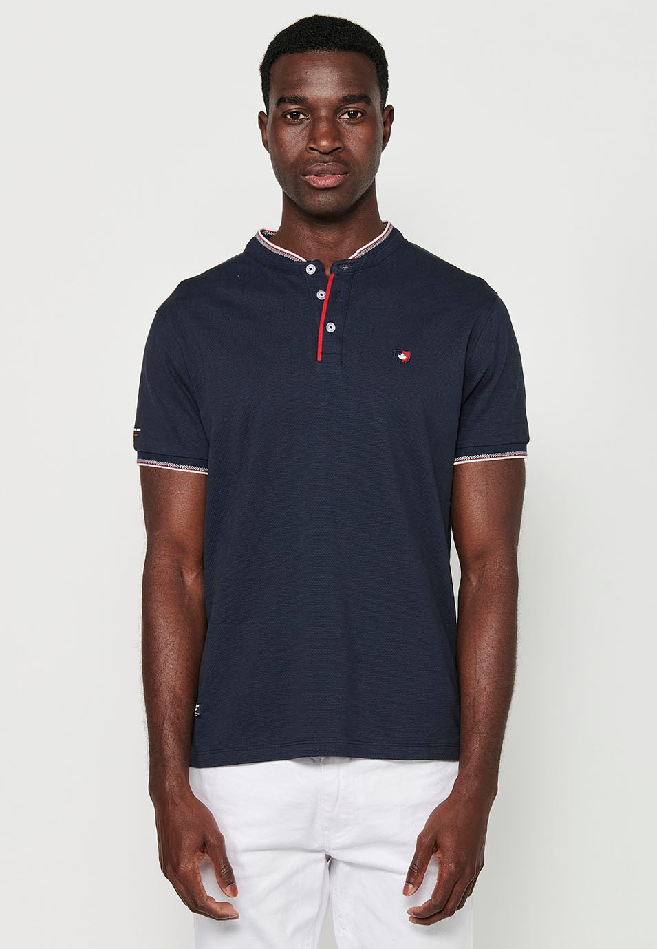 Short-sleeved cotton polo shirt with ribbed finish with round neck, buttoned opening and textured side slits in Navy Color for Men 4