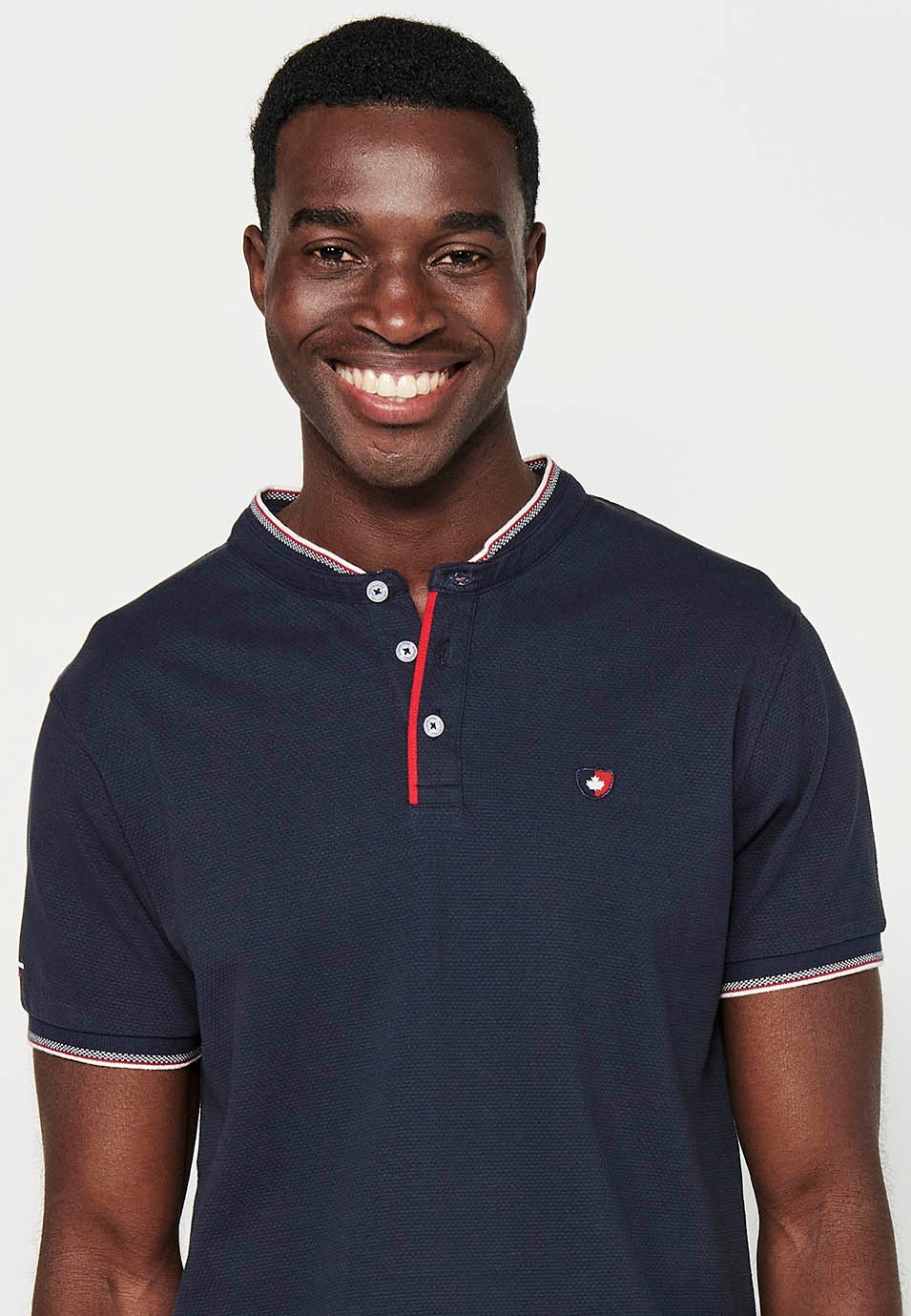 Short-sleeved cotton polo shirt with ribbed finish with round neck, buttoned opening and textured side slits in Navy Color for Men 3