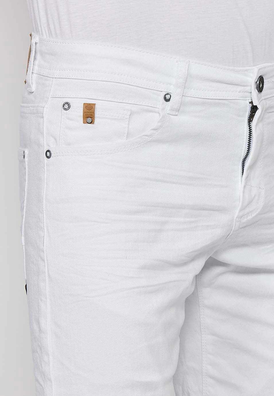 Denim Bermuda shorts with cuffed finish and front zipper and button closure. Five pockets, one match pocket, White for Men 8