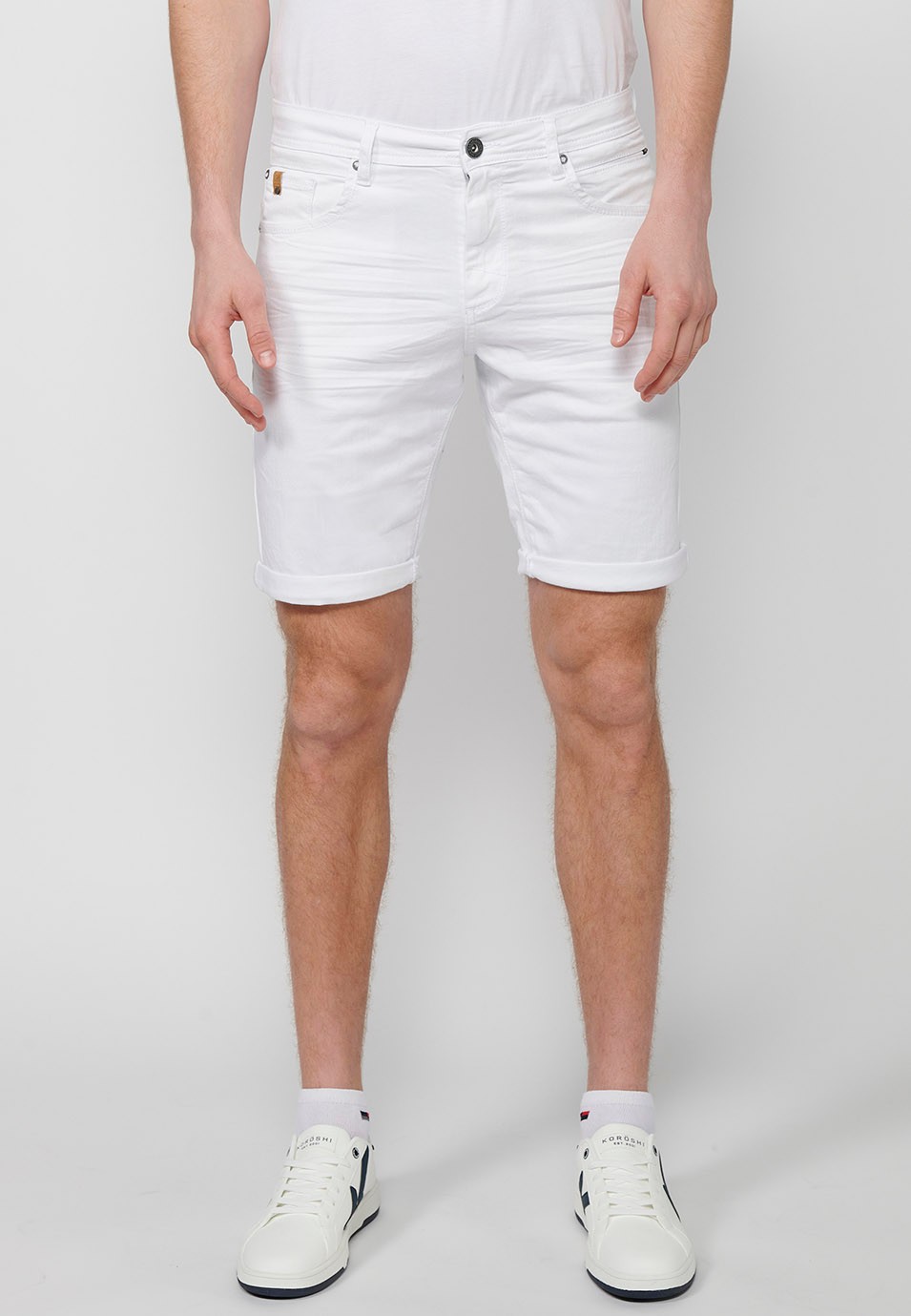 Denim Bermuda shorts with cuffed finish and front zipper and button closure. Five pockets, one match pocket, White for Men 4