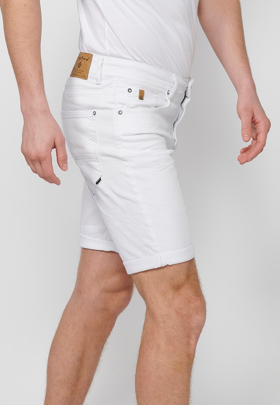 Denim Bermuda shorts with cuffed finish and front zipper and button closure. Five pockets, one match pocket, White for Men 3