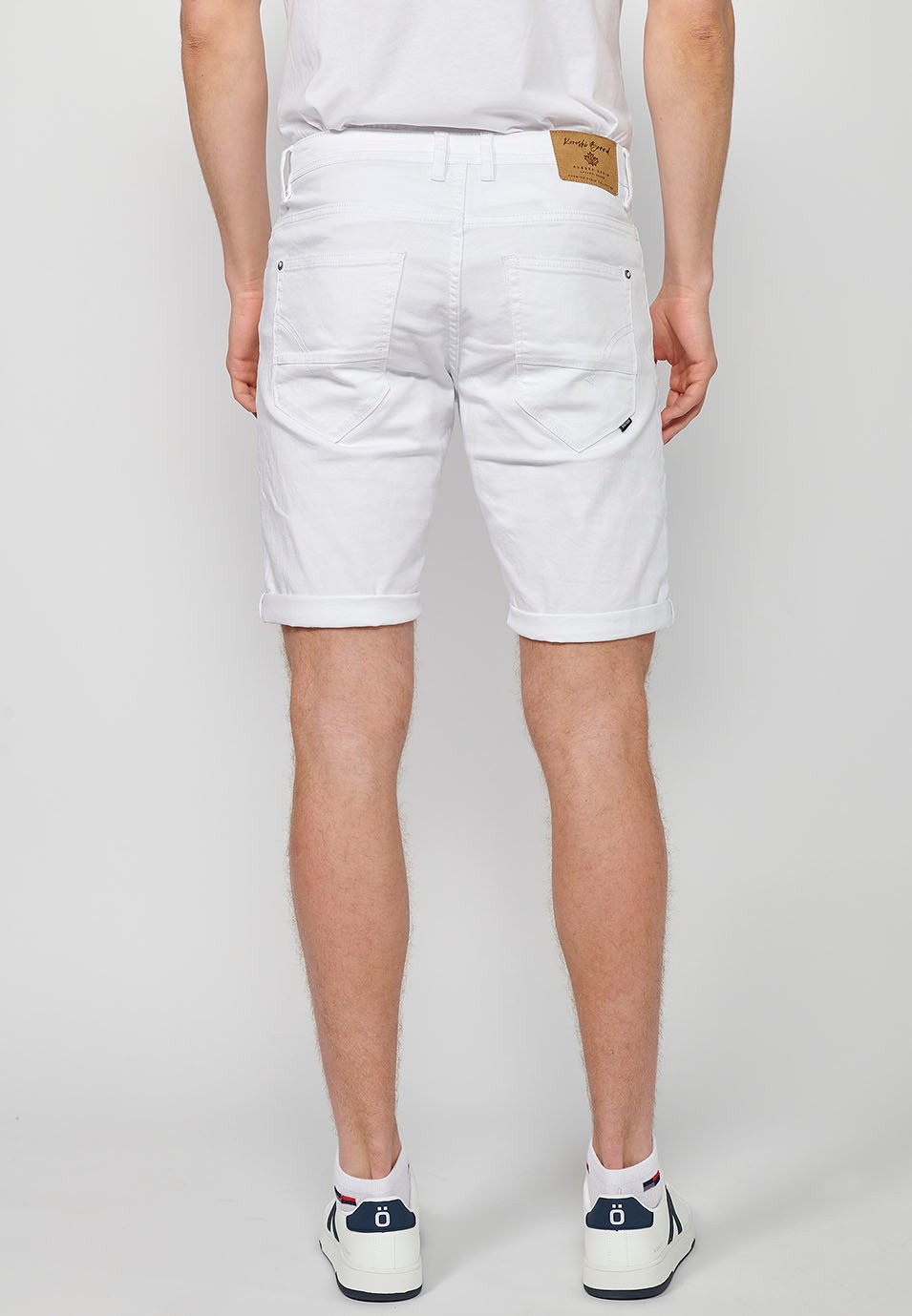 Denim Bermuda shorts with cuffed finish and front zipper and button closure. Five pockets, one match pocket, White for Men 1