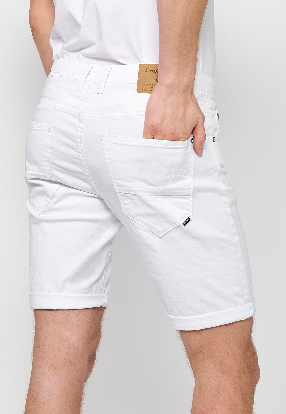 Denim Bermuda shorts with cuffed finish and front zipper and button closure. Five pockets, one match pocket, White for Men 7