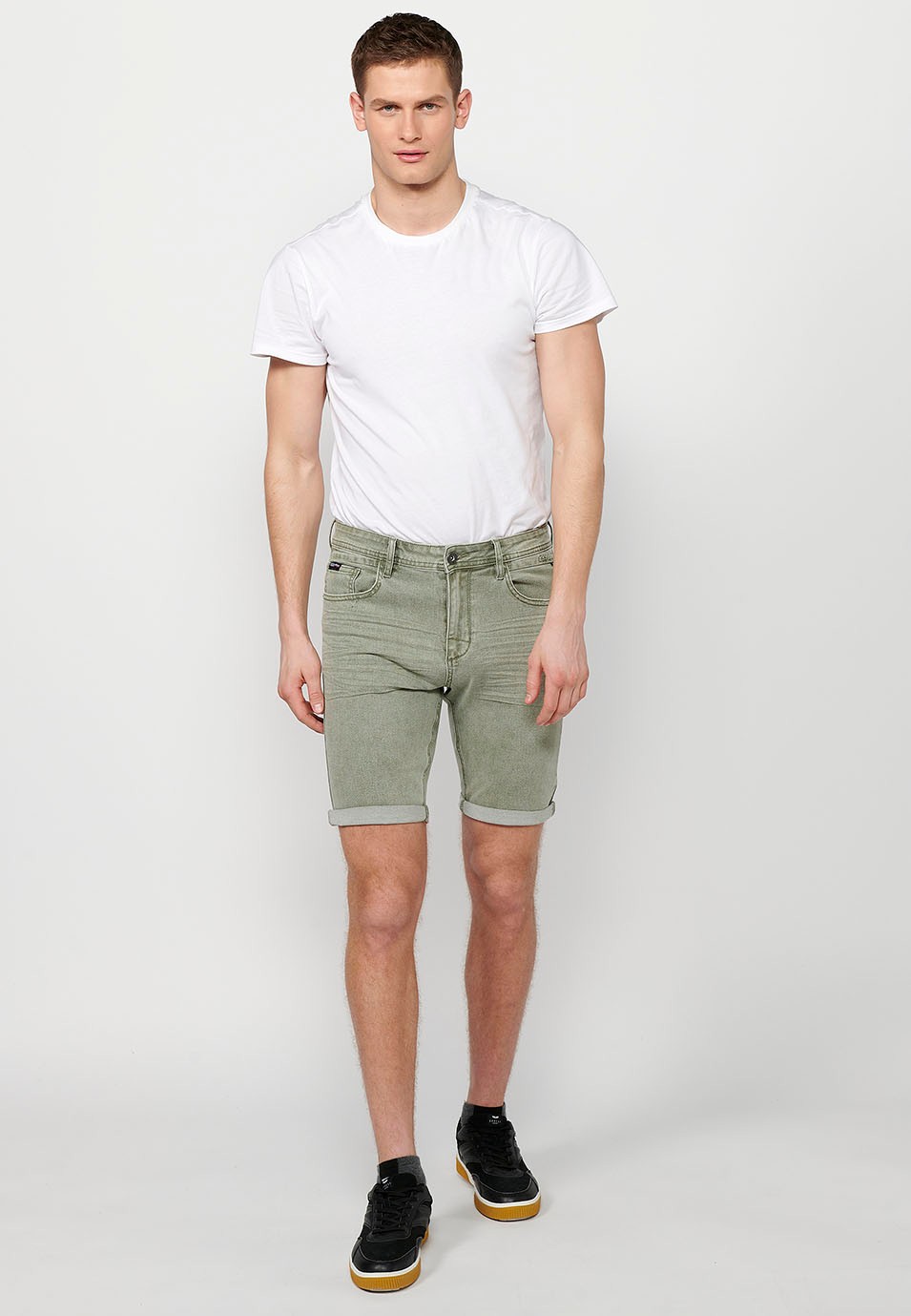 Shorts with a turn-up finish with front zipper and button closure and five pockets, one with a match pocket, in Green for Men