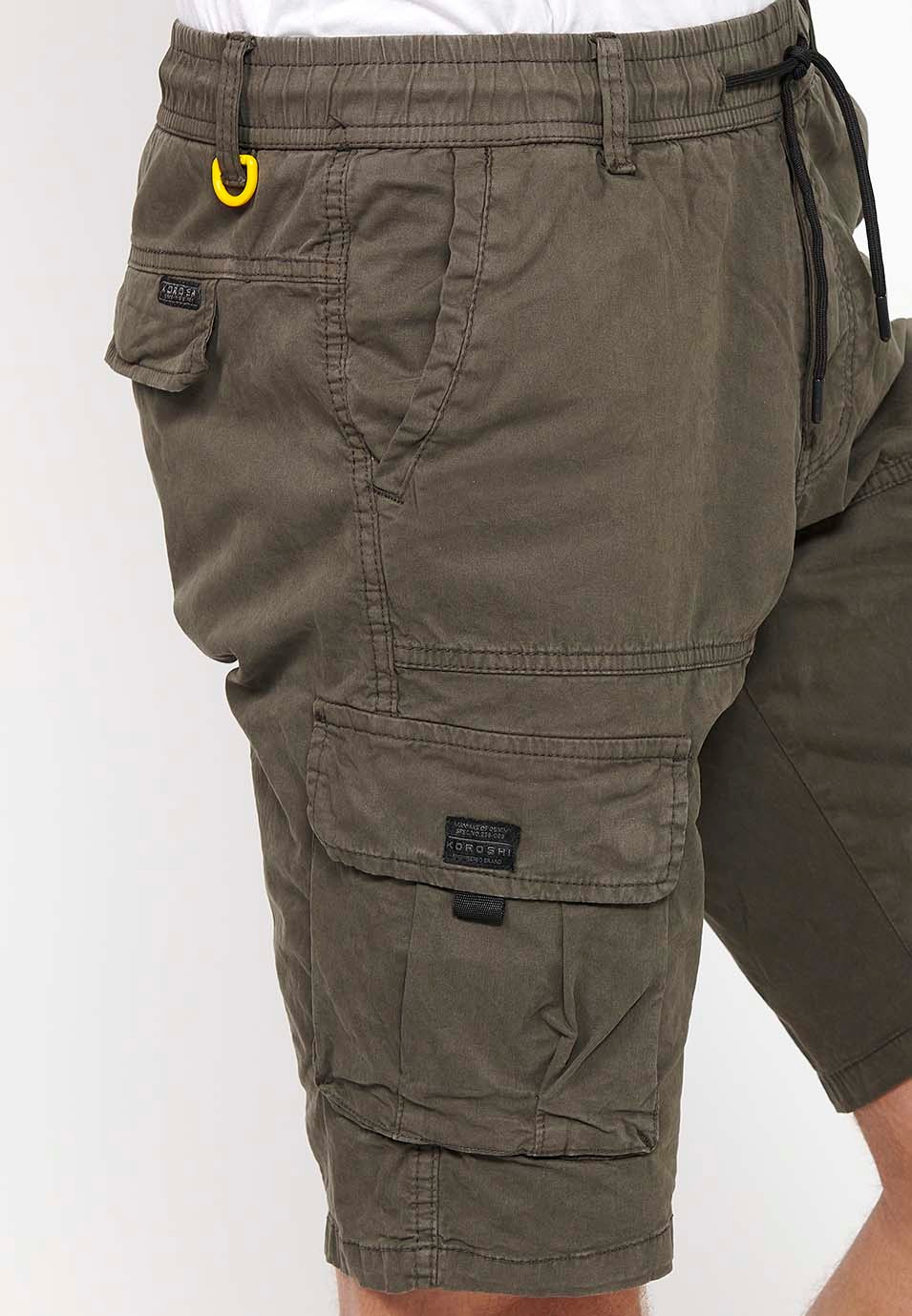 Cargo shorts with side pockets with flap and front closure with zipper and button in Olive Color for Men