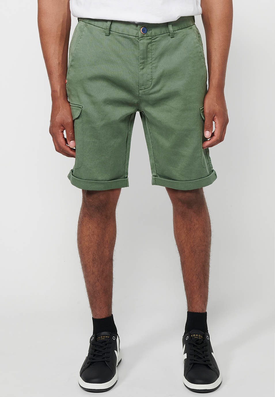 Shorts with rubberized waist and zipper and button closure with pockets, two sides with flap in Green for Men 1
