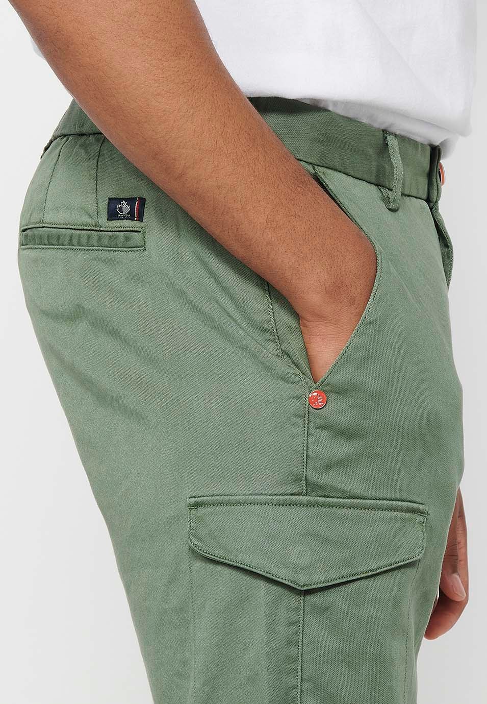 Shorts with rubberized waist and zipper and button closure with pockets, two sides with flap in Green for Men 8