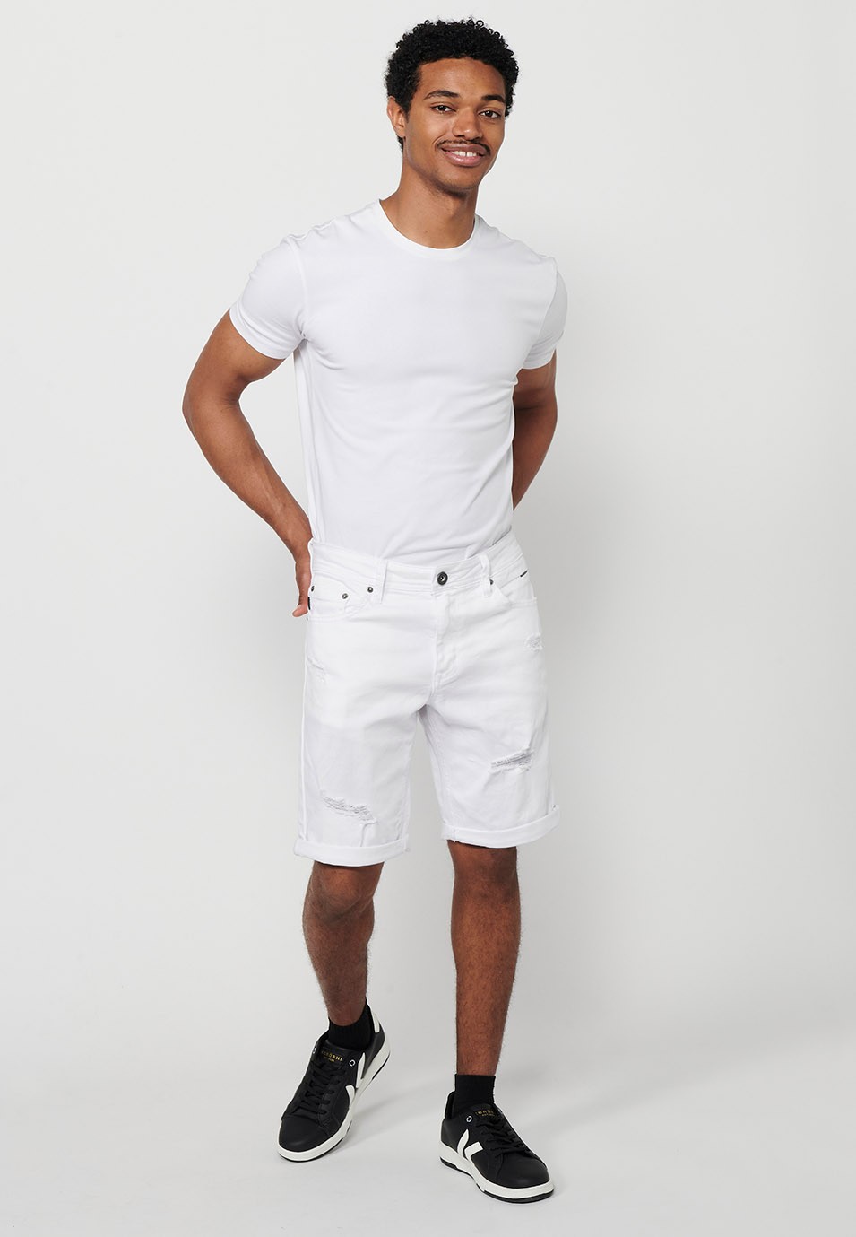 Denim Bermuda shorts with turn-up finish and front closure with zipper and button in White for Men