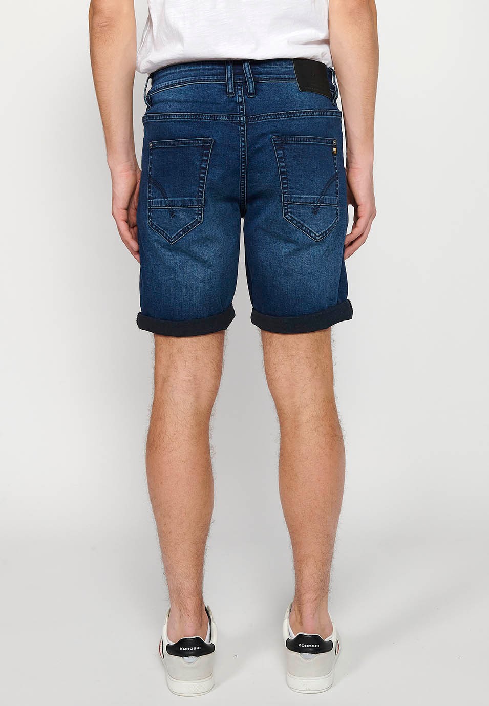 Denim shorts with front zipper and button closure and five pockets, one blue color pocket for Men