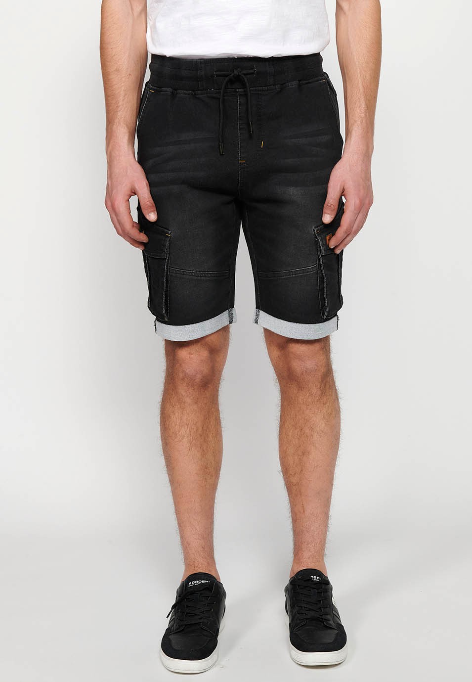 Denim Bermuda cargo jogger shorts finished with a turn-up, Adjustable waist with elastic and drawstring, Side pockets with flap, Black for Men