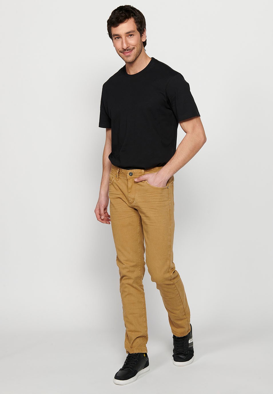 Long straight regular fit pants with front closure with zipper and button with five pockets, one pocket in Tan Color for Men