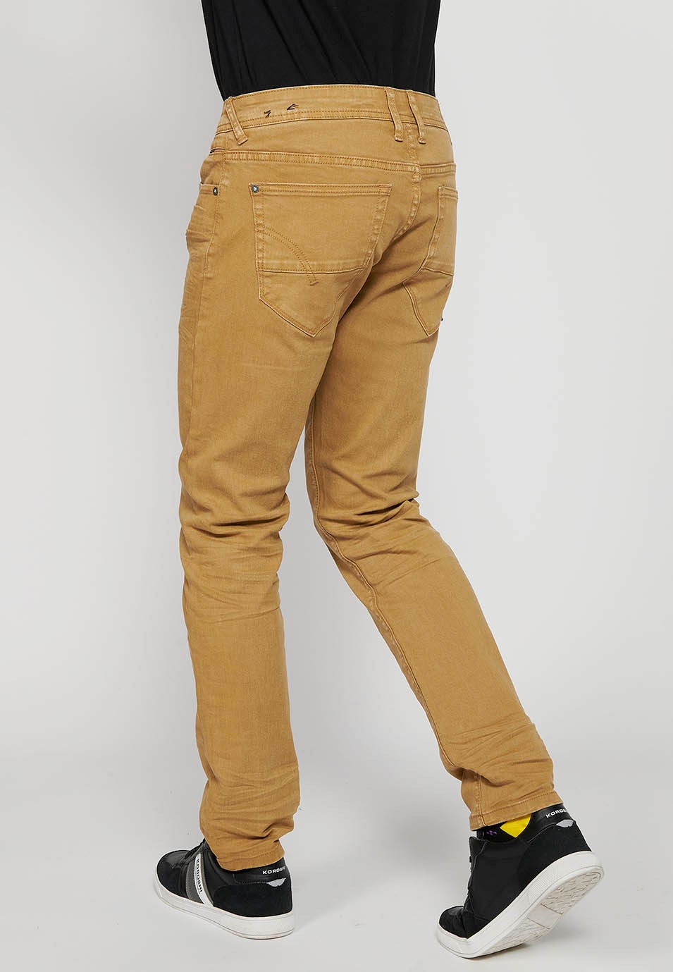Long straight regular fit pants with front closure with zipper and button with five pockets, one pocket in Tan Color for Men