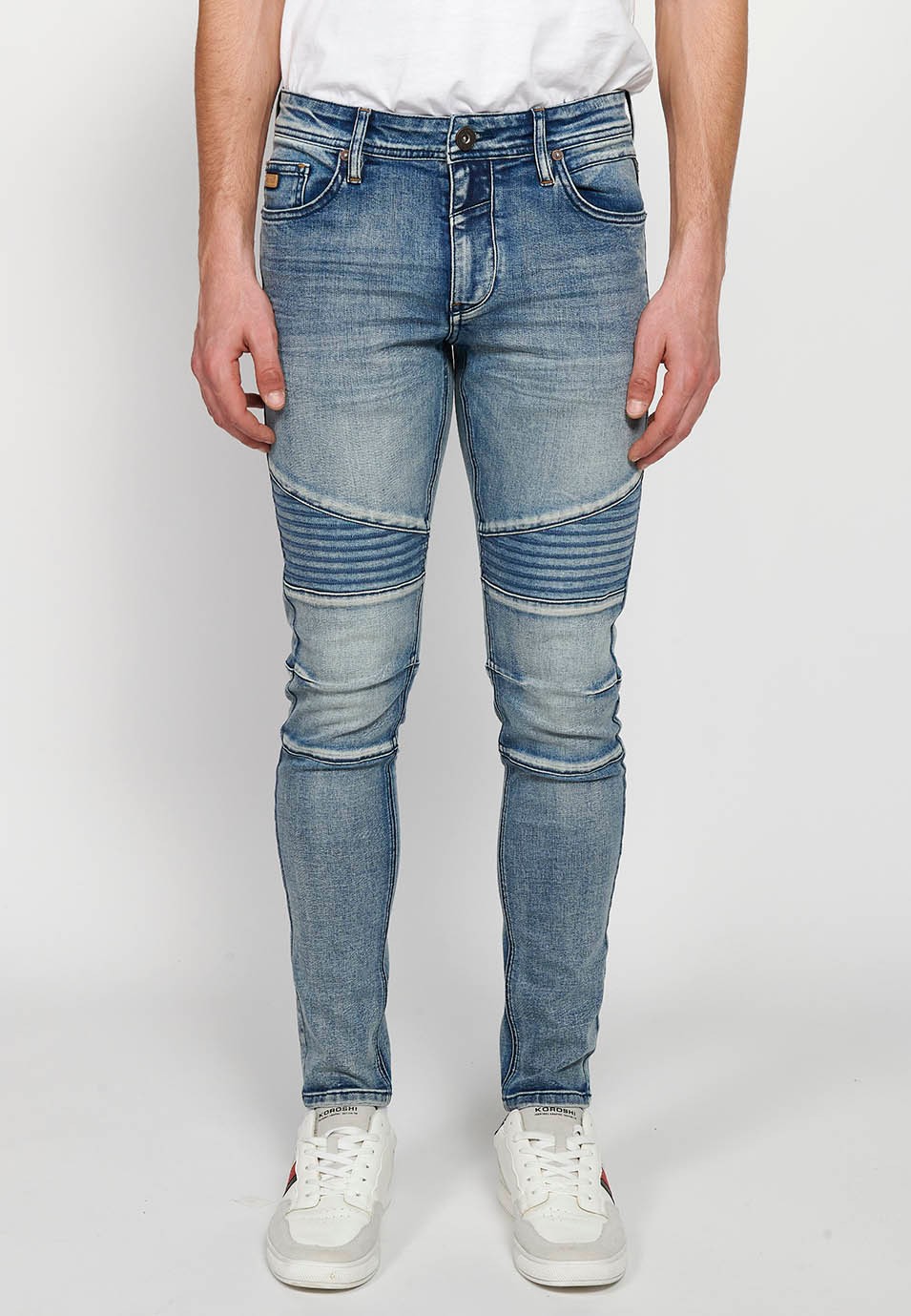 Long skinny fit biker jeans with front zipper and button closure and cut details on the knees in Blue for Men 6
