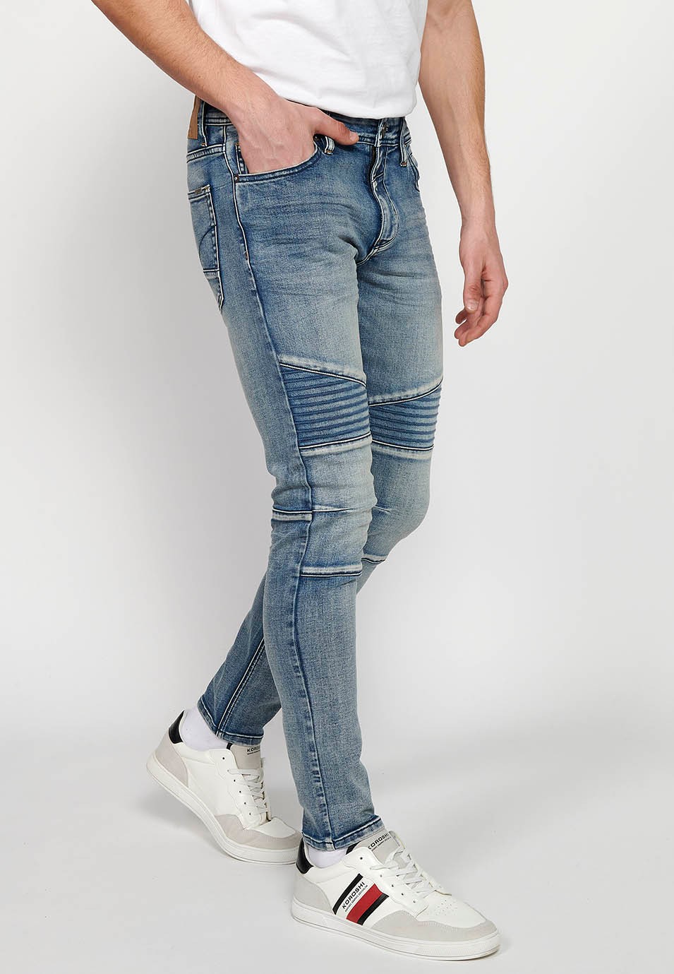 Long skinny fit biker jeans with front zipper and button closure and cut details on the knees in Blue for Men 1