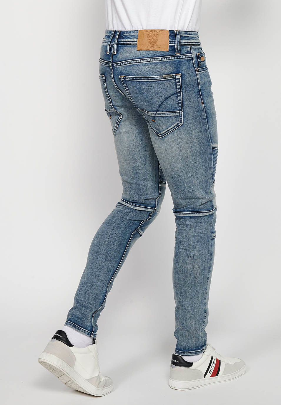Long skinny fit biker jeans with front zipper and button closure and cut details on the knees in Blue for Men 5