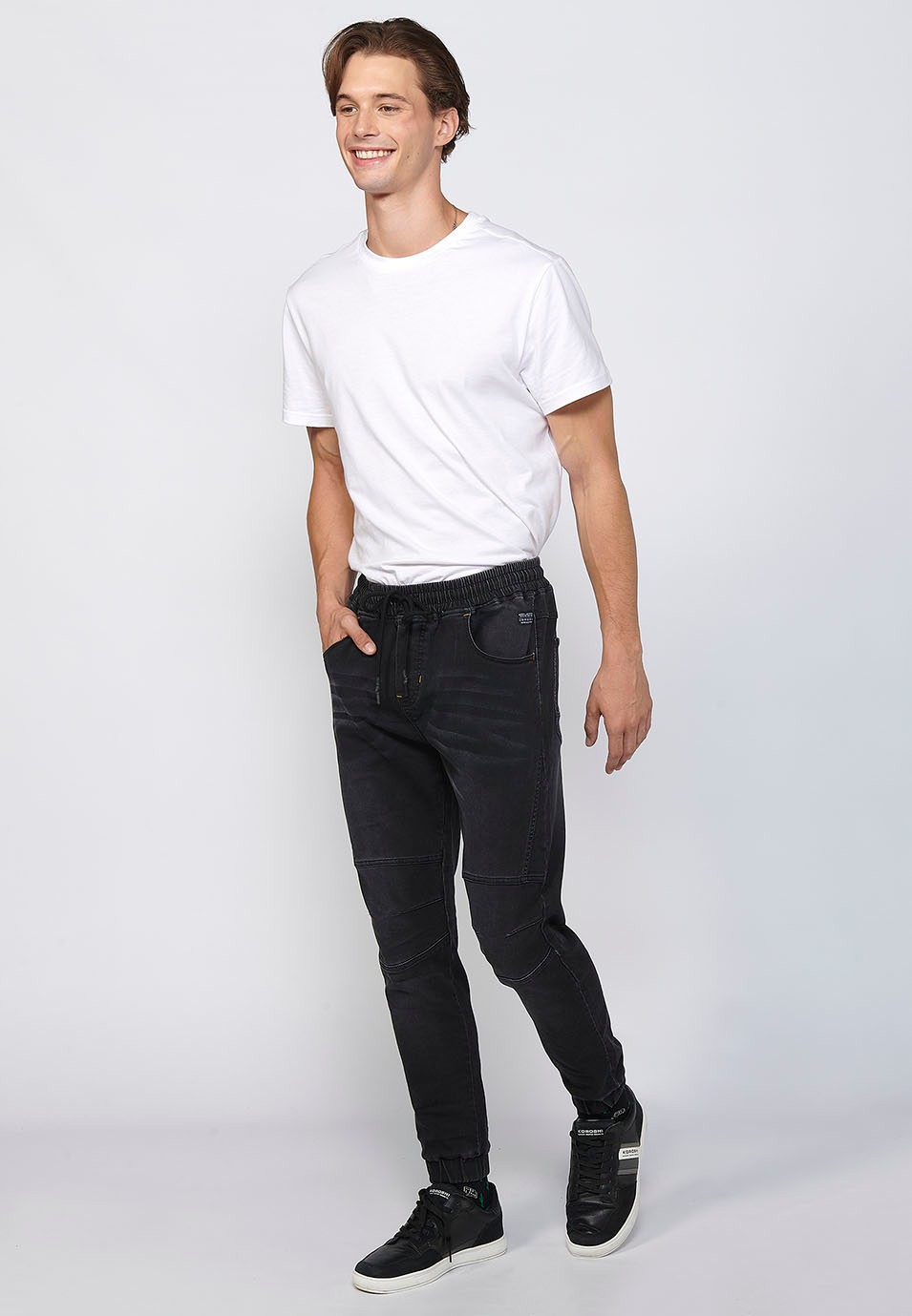 Long slim jogger pants fitted at the ankles with adjustable elastic waist and drawstring in Black for Men