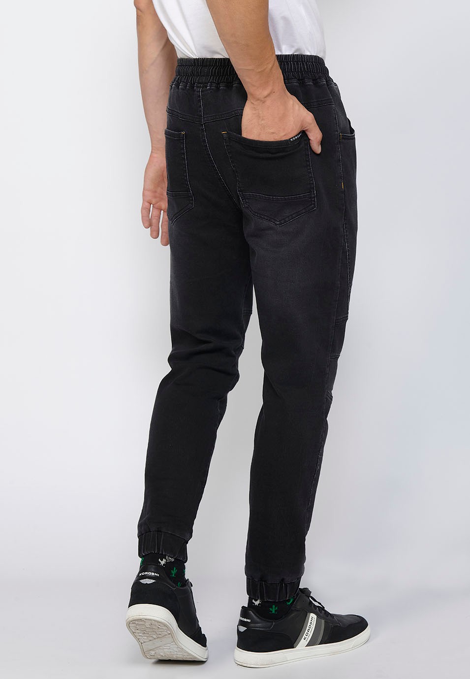 Long slim jogger pants fitted at the ankles with adjustable elastic waist and drawstring in Black for Men 7