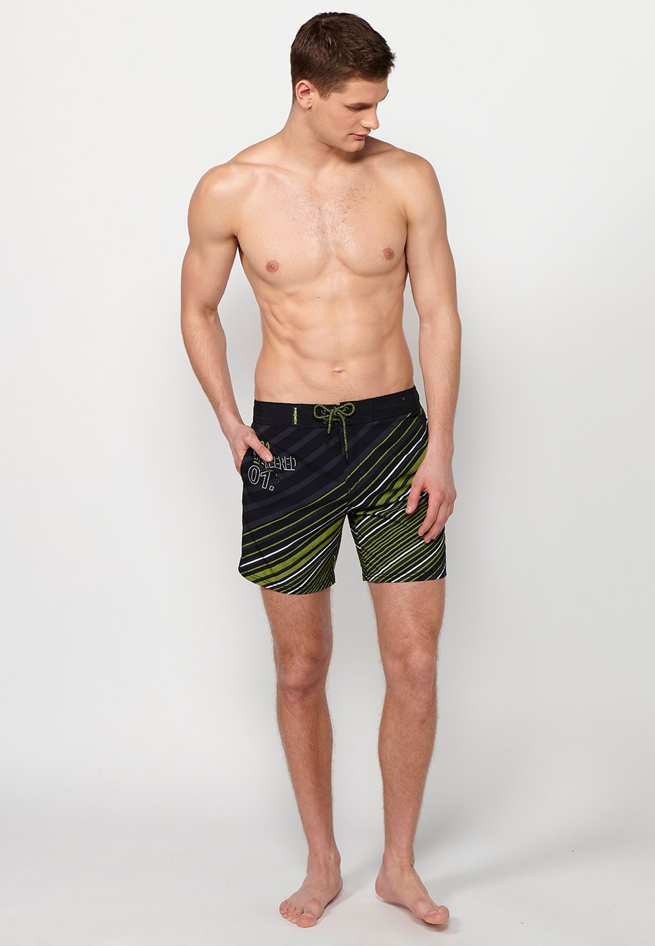 Printed short swimsuit with adjustable waist with drawstring and back pocket and one interior pocket in Lime Color for Men