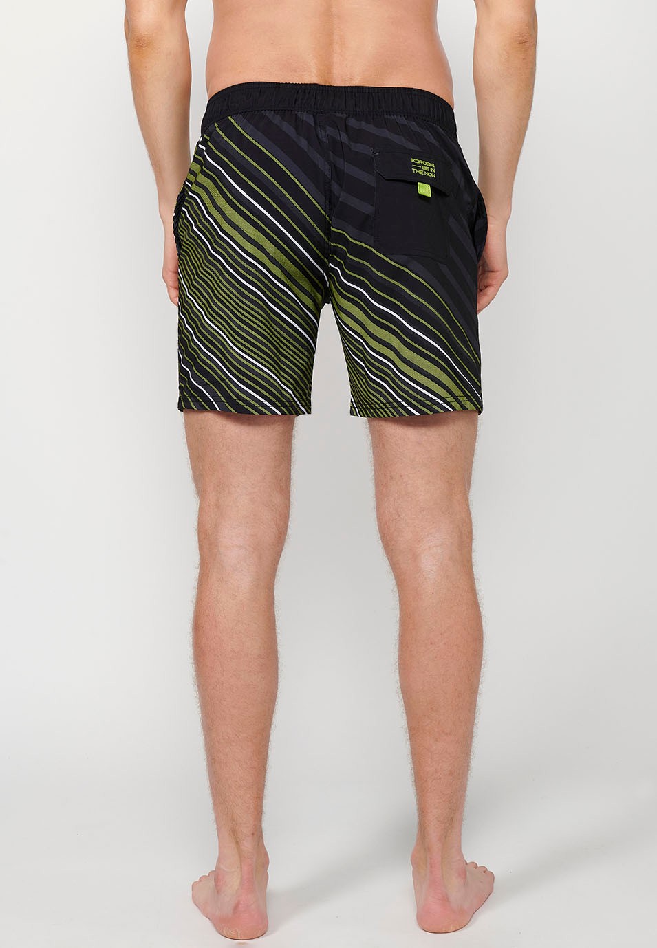 Printed short swimsuit with adjustable waist with drawstring and back pocket and one interior pocket in Lime Color for Men 7