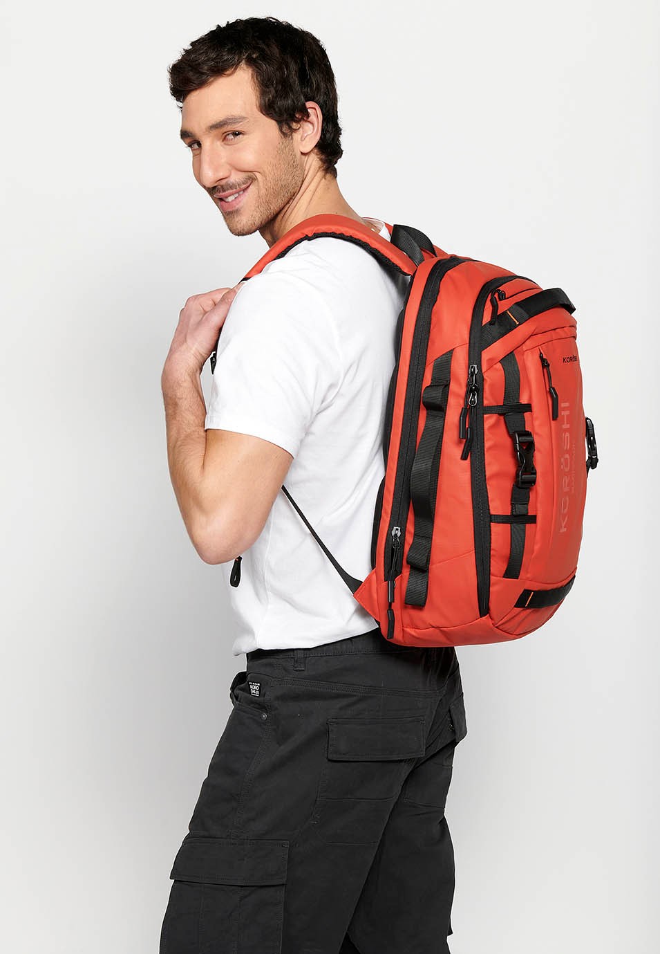Koröshi backpack with two zippered compartments, one for a laptop and adjustable straps in Red 5