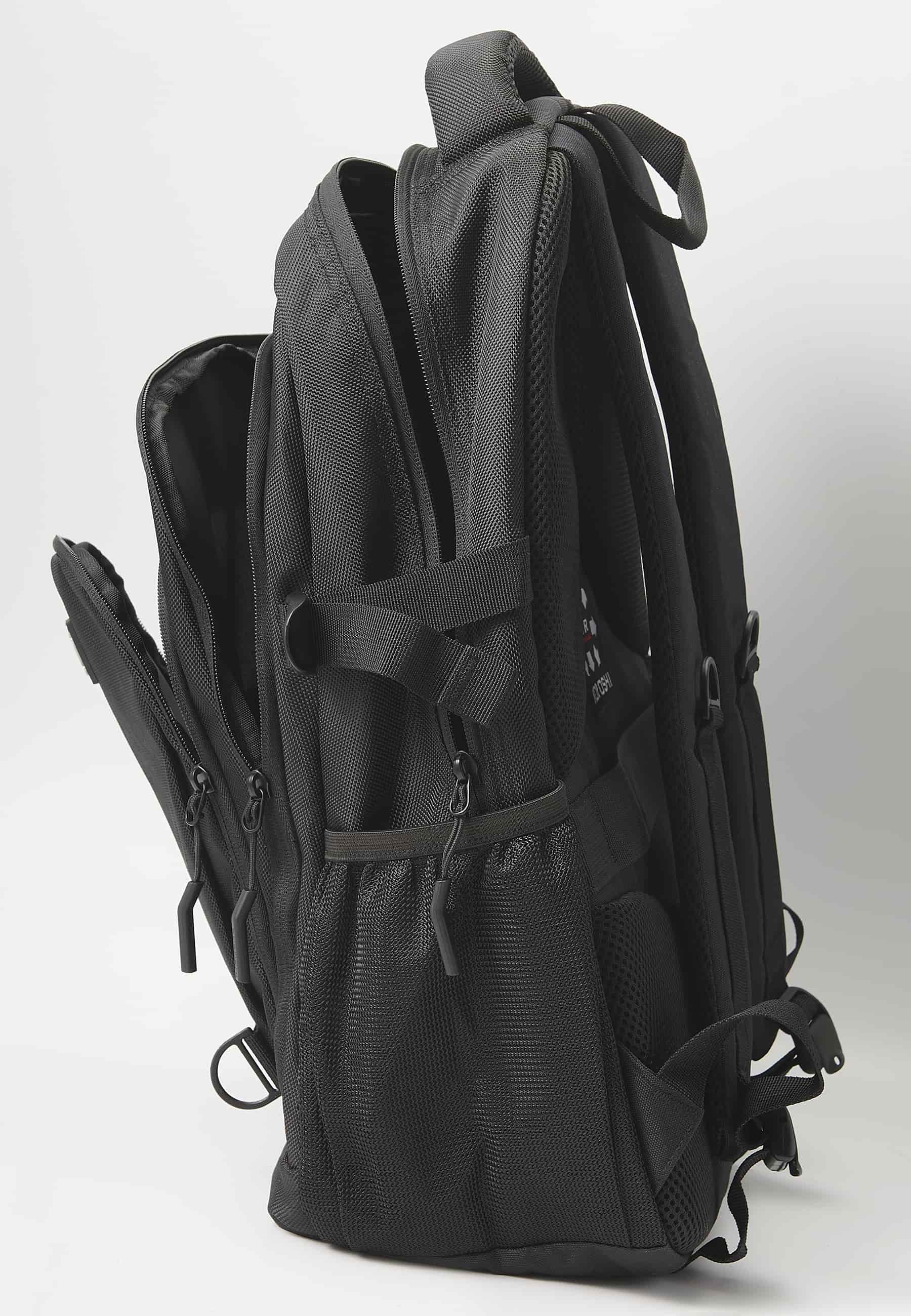 Koröshi backpack with three zippered compartments, one for a laptop, with black interior pockets