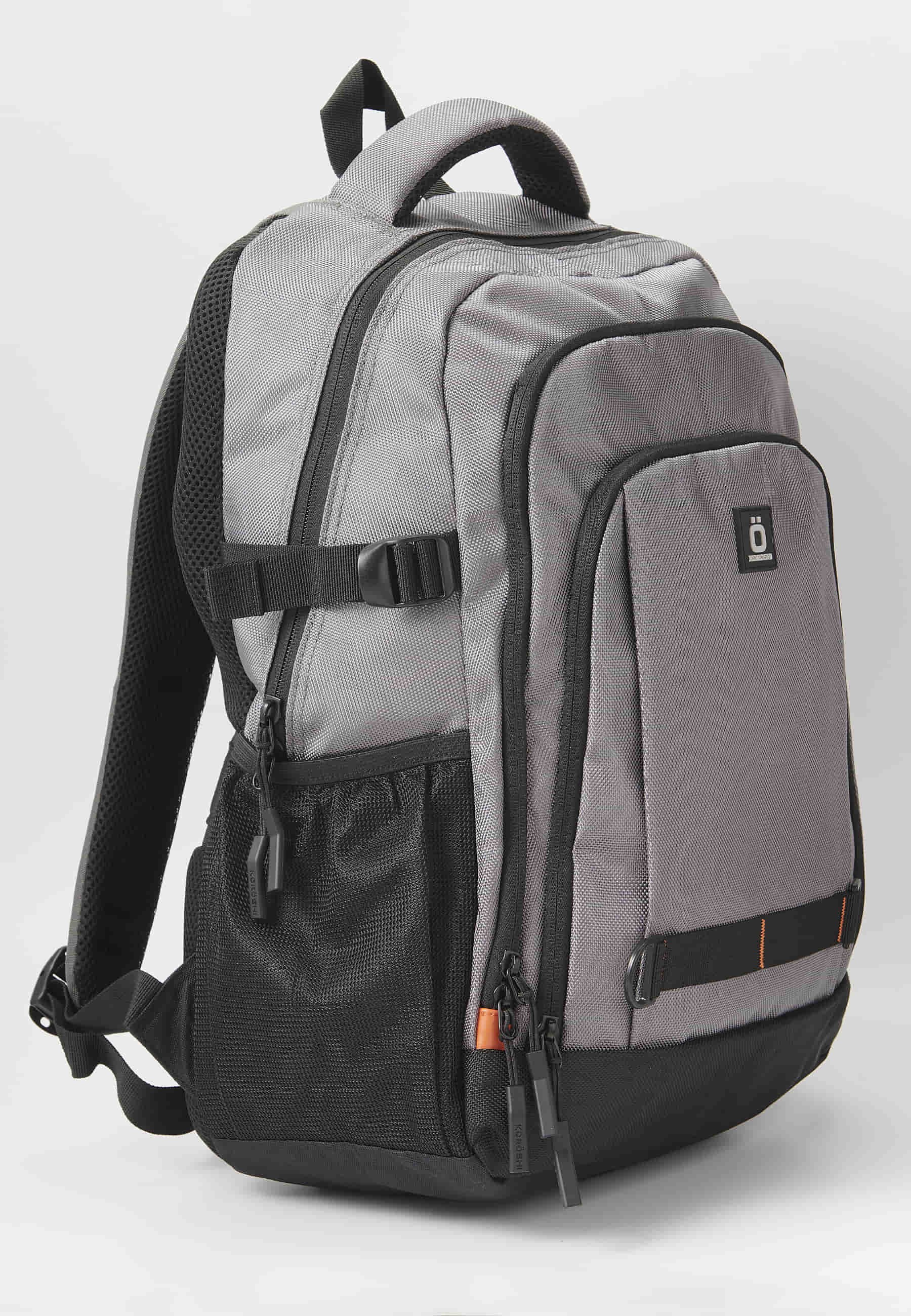 Mochila koröshi con tres compartimentos cerrados con cremallera, uno para portátil, con bolsillos interiores color gris | Estilo y Comodidad