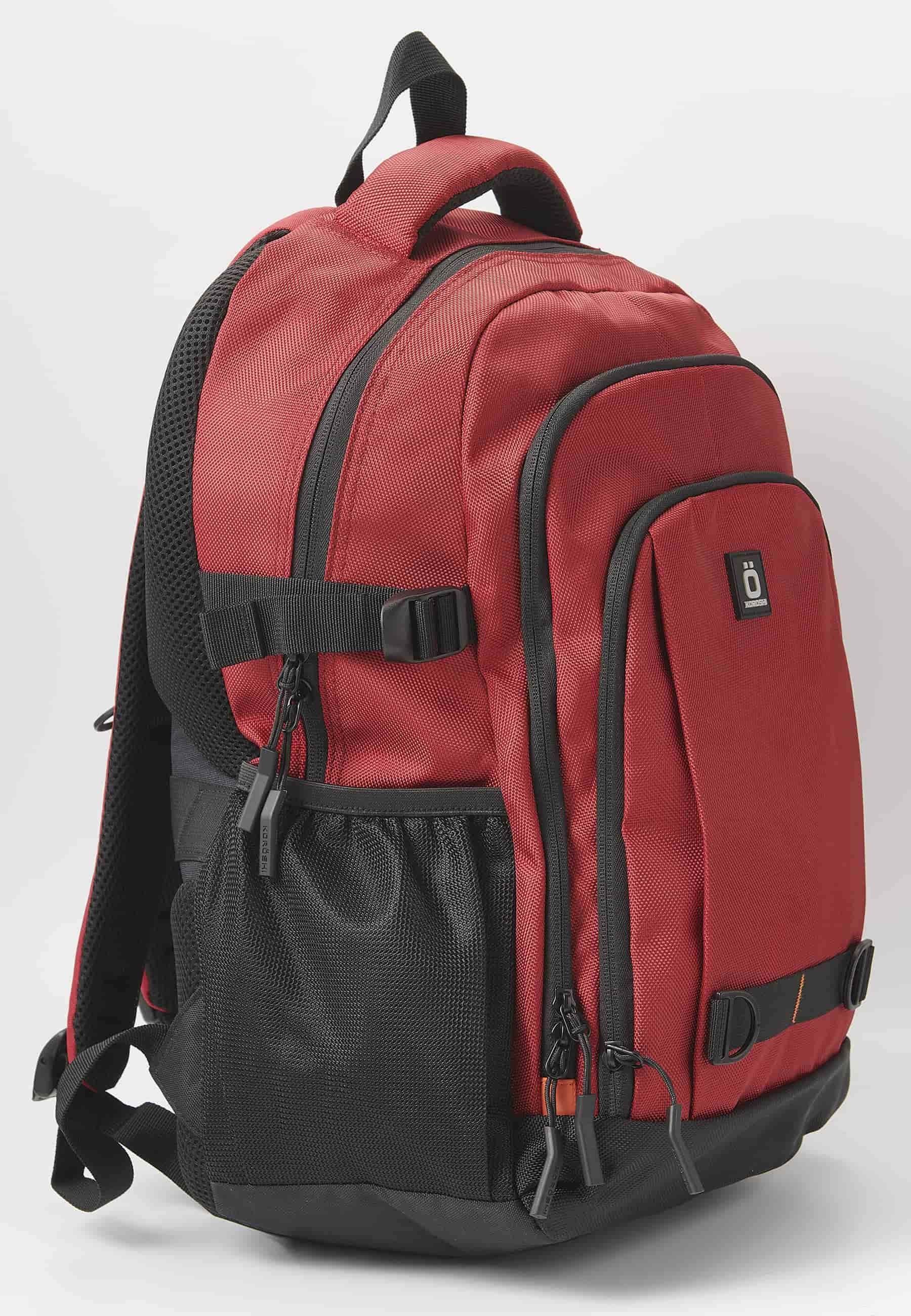 Mochila koröshi con tres compartimentos cerrados con cremallera, uno para portátil, con bolsillos interiores color rojo | Estilo y Comodidad