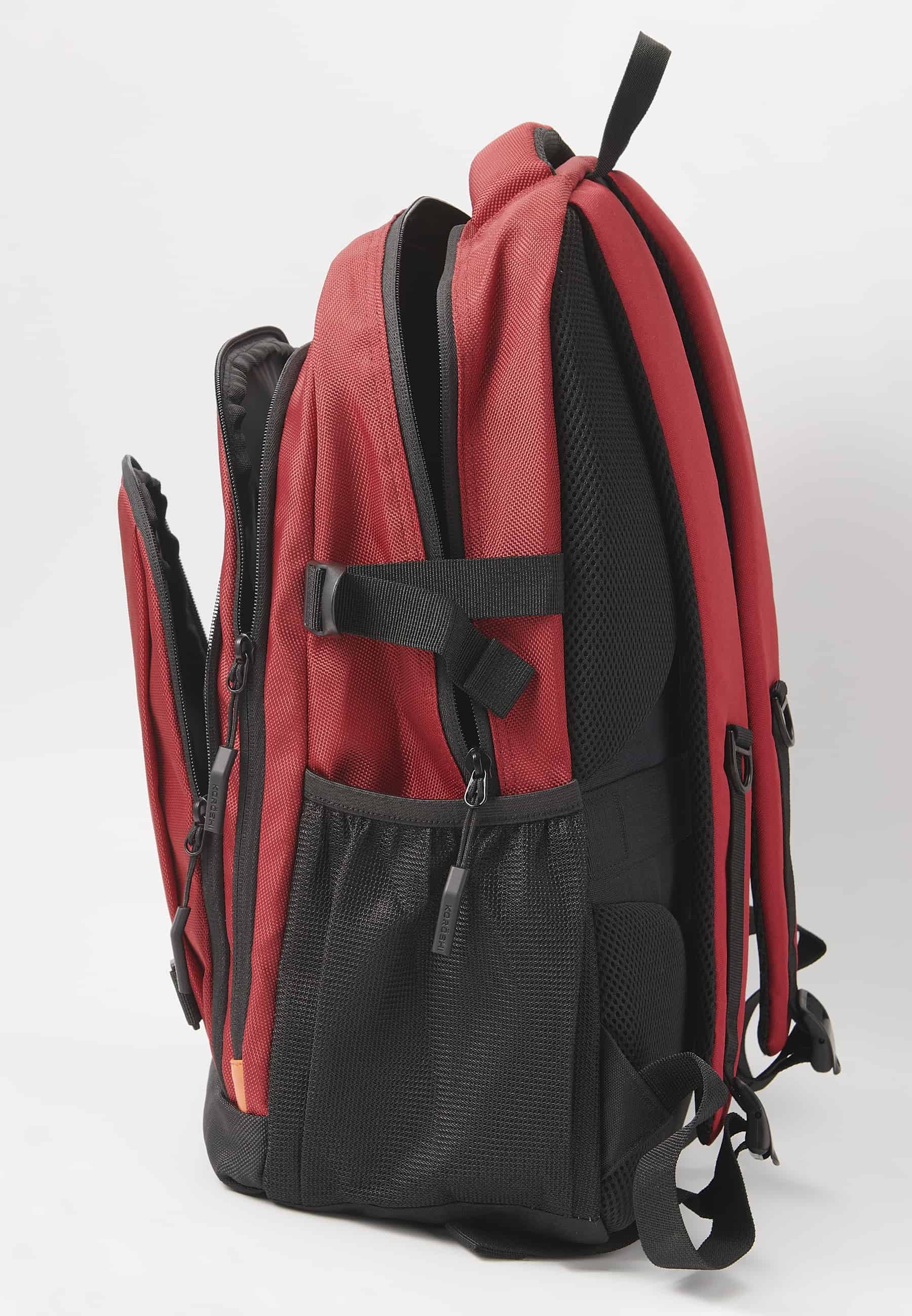 Koröshi backpack with three zippered compartments, one for laptop, with red interior pockets