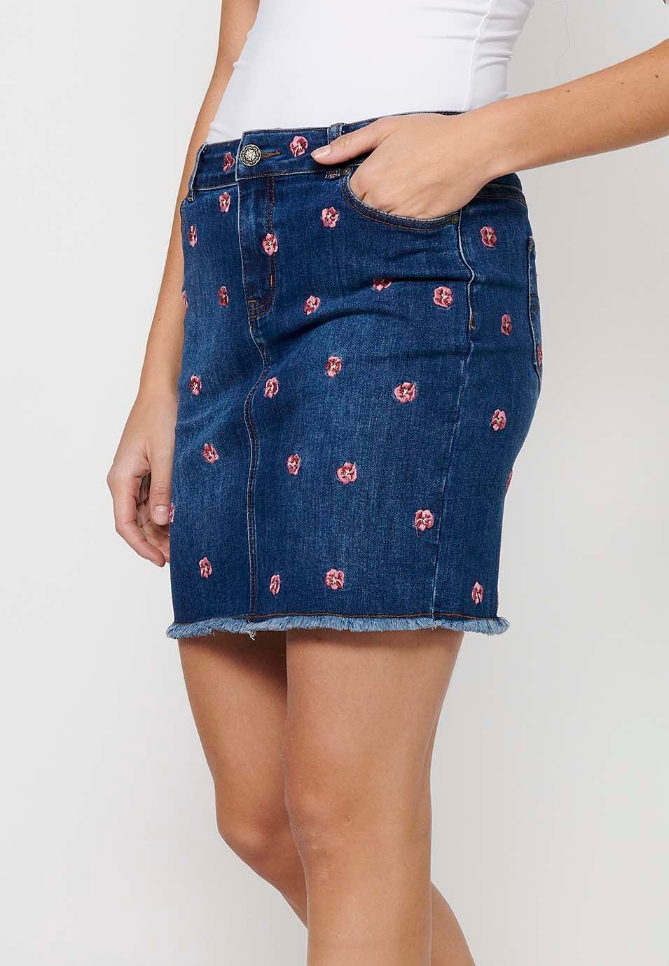 Short denim skirt made of embroidered fabric with front zipper closure and dark blue button for Women 1