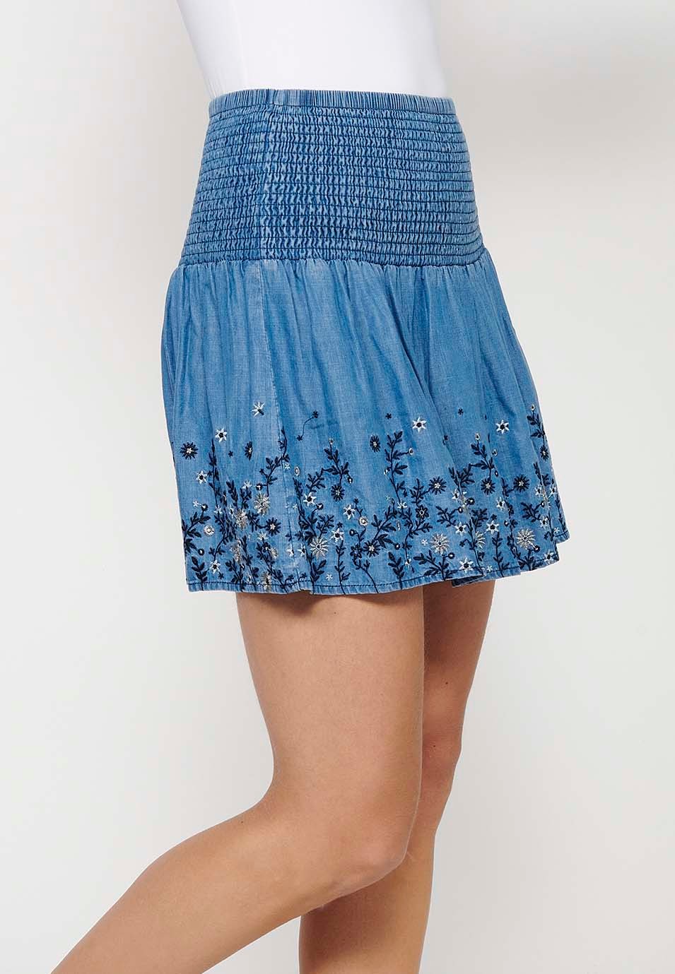 Short skirt with wide elastic waist and finished with blue floral embroidery for Women 3