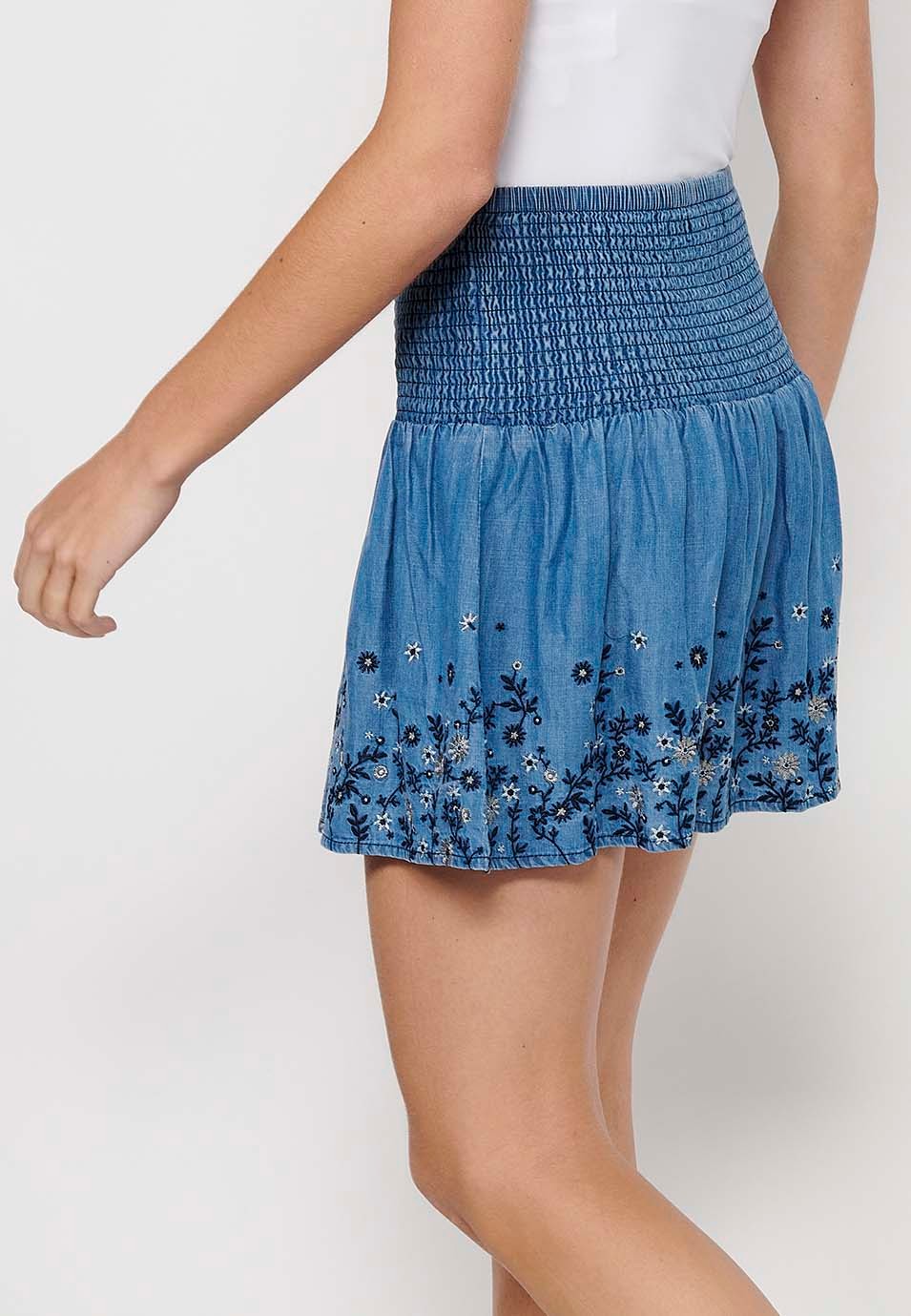 Short skirt with wide elastic waist and finished with blue floral embroidery for Women 5
