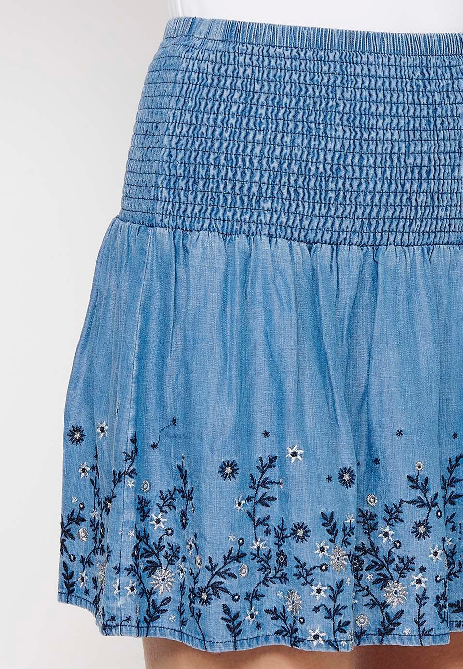 Short skirt with wide elastic waist and finished with blue floral embroidery for Women 6