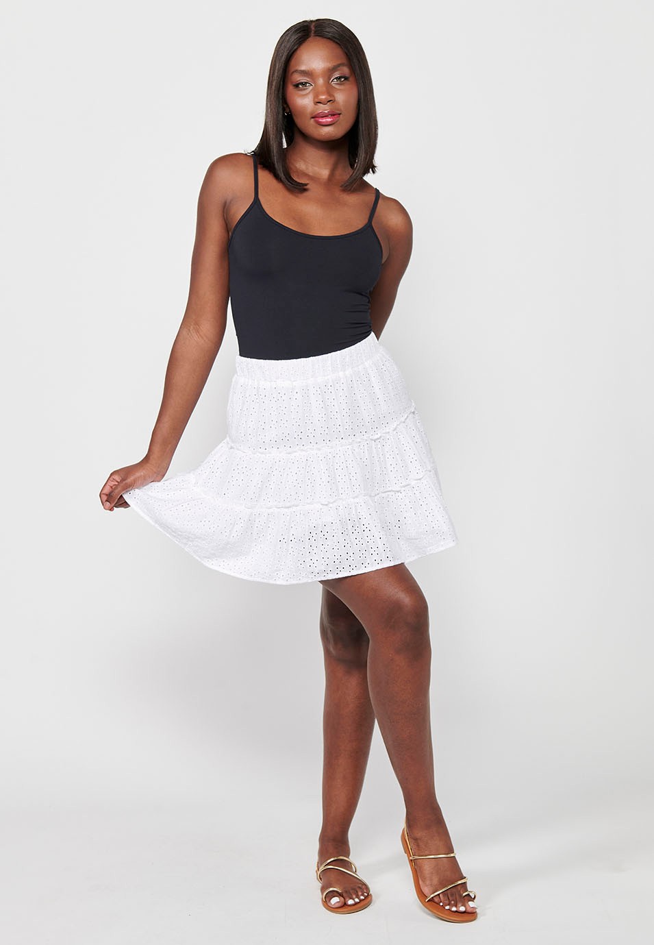 Short cotton skirt, with ruffle and embroidery, fitted at the waist with elastic band, white color for women
