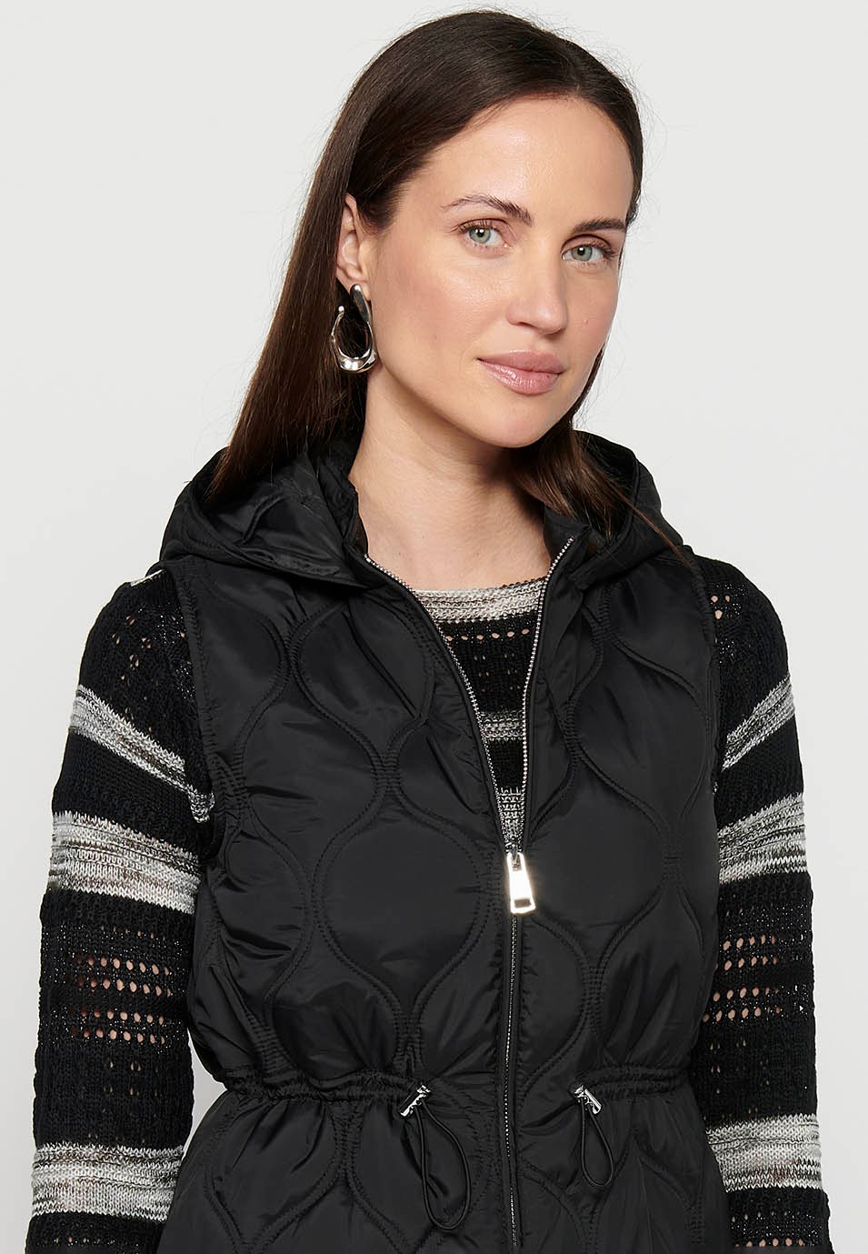 Padded vest with hooded collar and front zipper closure in Black for Women