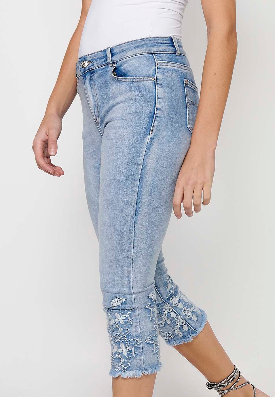 Long denim pirate pants with front zipper and button closure with blue floral embroidery for women 4