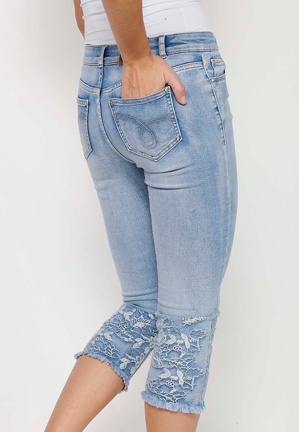 Long denim pirate pants with front zipper and button closure with blue floral embroidery for women 7