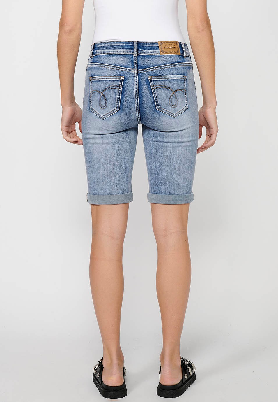 Short shorts finished in turn with details of front patches and removable chain decoration with front closure with zipper and button in Blue for Women 5