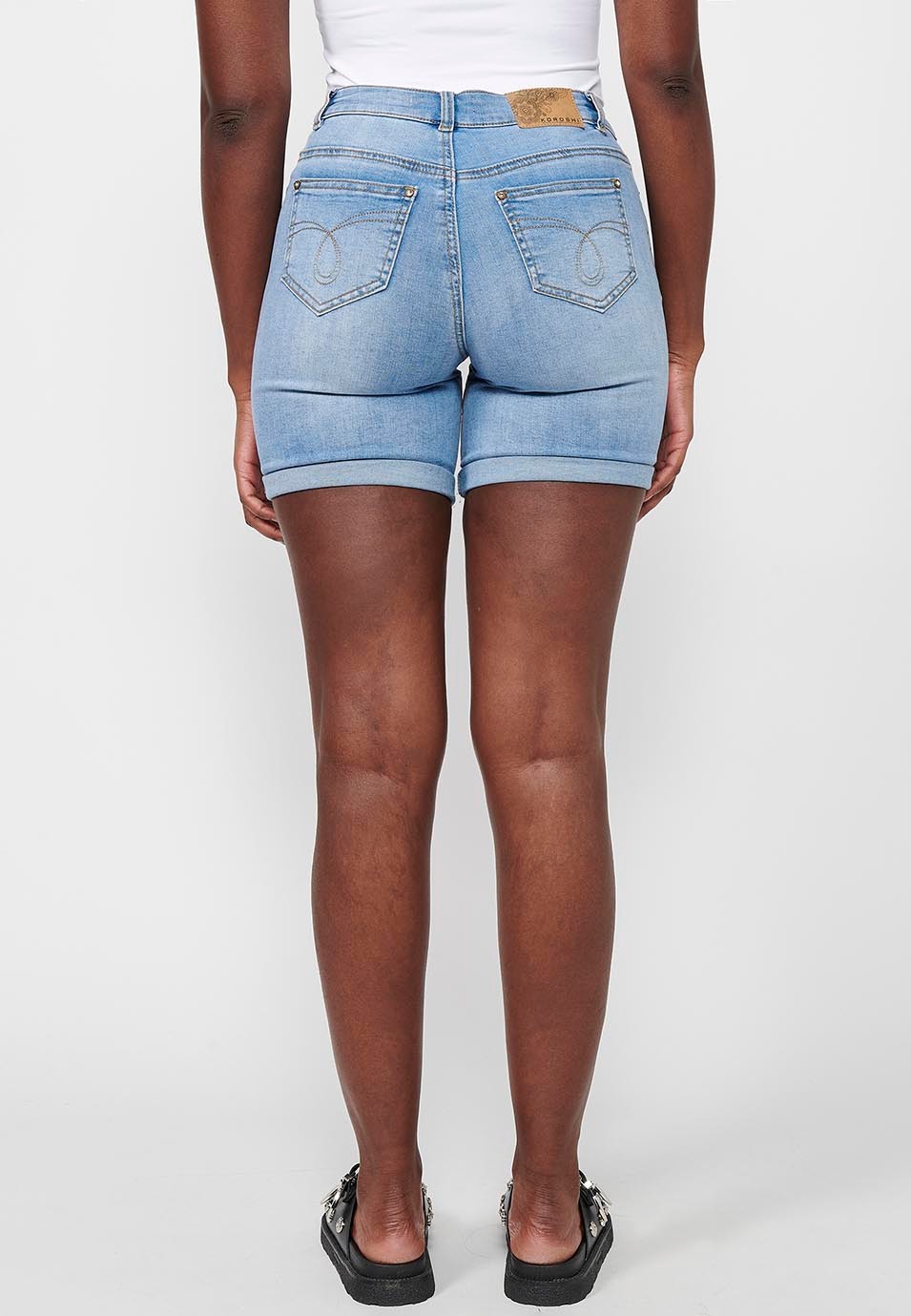 Shorts with cuffed finish with front zipper and button closure with embroidered details in Blue for Women 1