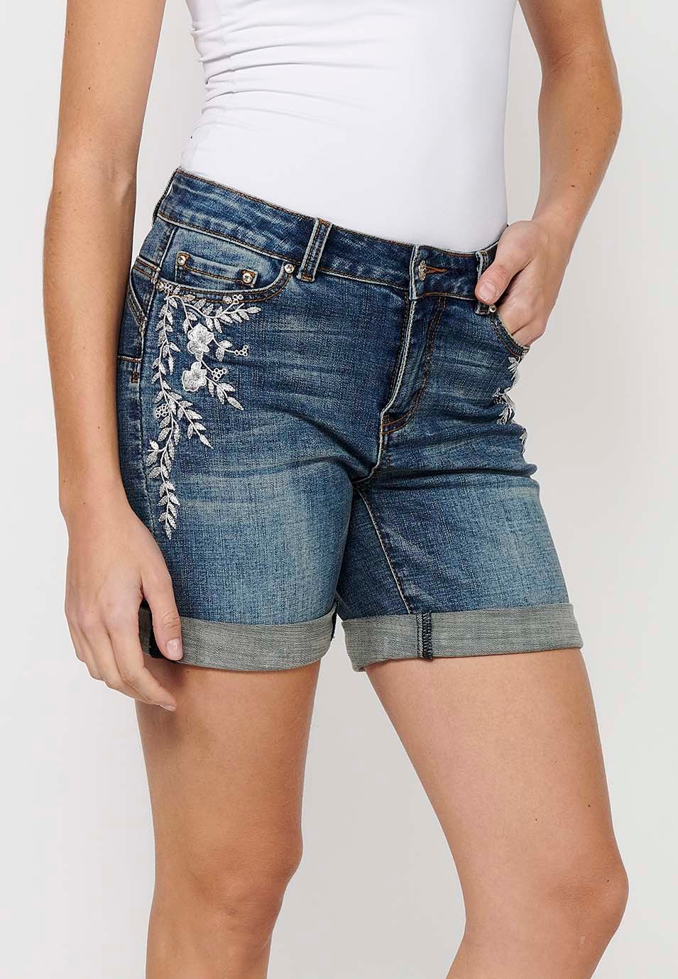 Short shorts with a turn-up finish with front zipper and button closure and blue floral embroidery for Women 1